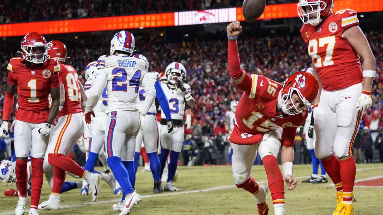Kansas City Chiefs quarterback Patrick Mahomes (15) celebrates his touchdown with Kansas City Chiefs tight end Travis Kelce (87) during the second half of the AFC Championship NFL football game against the Buffalo Bills, Sunday, Jan. 26, 2025, in Kansas City, Mo.