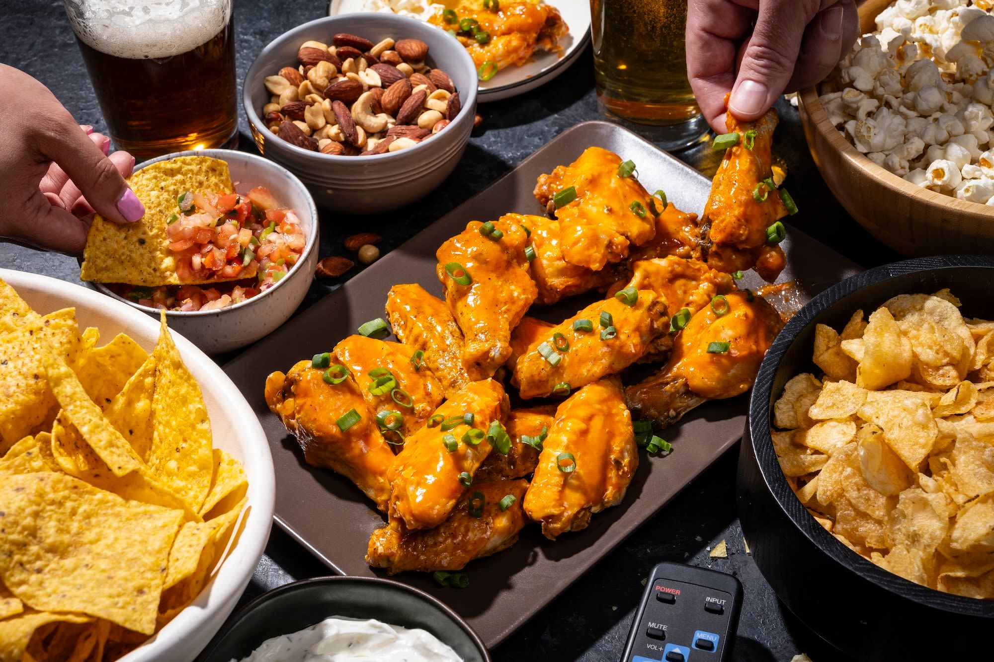 Celebrating football’s biggest game can bring big appetites. Buying Super Bowl fixings this year will cost about the same as last year, but the prices of individual products may seesaw, according to a Wells Fargo report.