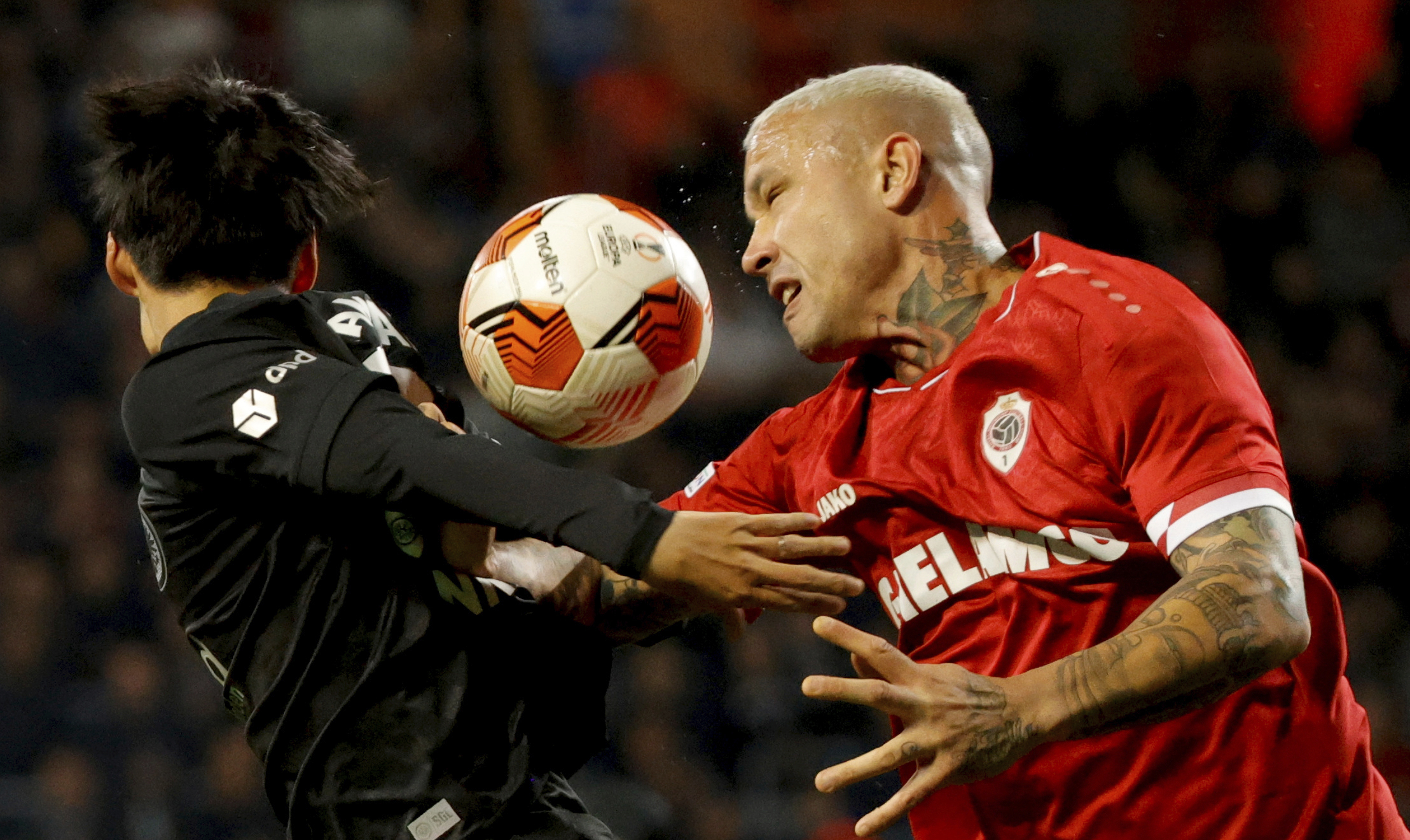 FILE - Frankfurt's Daichi Kamada, left, goes up against Royal Antwerp's Radja Nainggolan during the Europa League group D soccer match between Royal Antwerp and Frankfurt at the Bosuil Stadium in Deurne, Belgium, Sept. 30, 2021. 