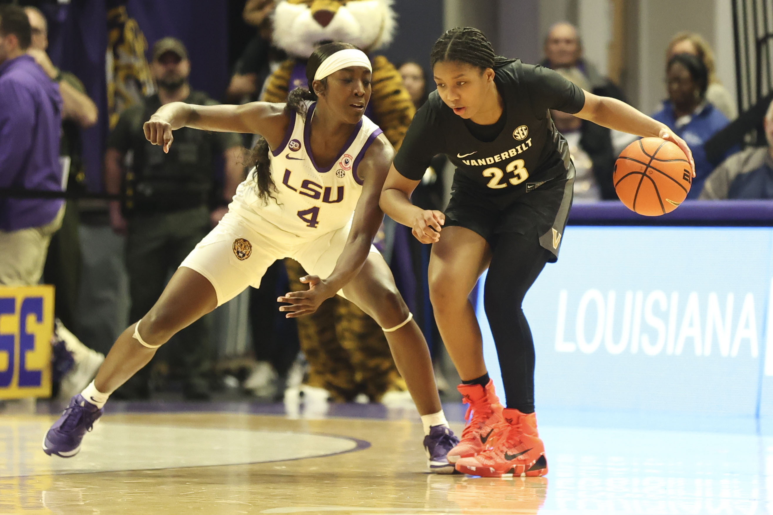 LSU guard Flau'Jae Johnson (4) defends against Vanderbilt guard Iyana Moore (23) during the second half of an NCAA college basketball game in Baton Rouge, La., Monday, Jan. 13, 2025. 
