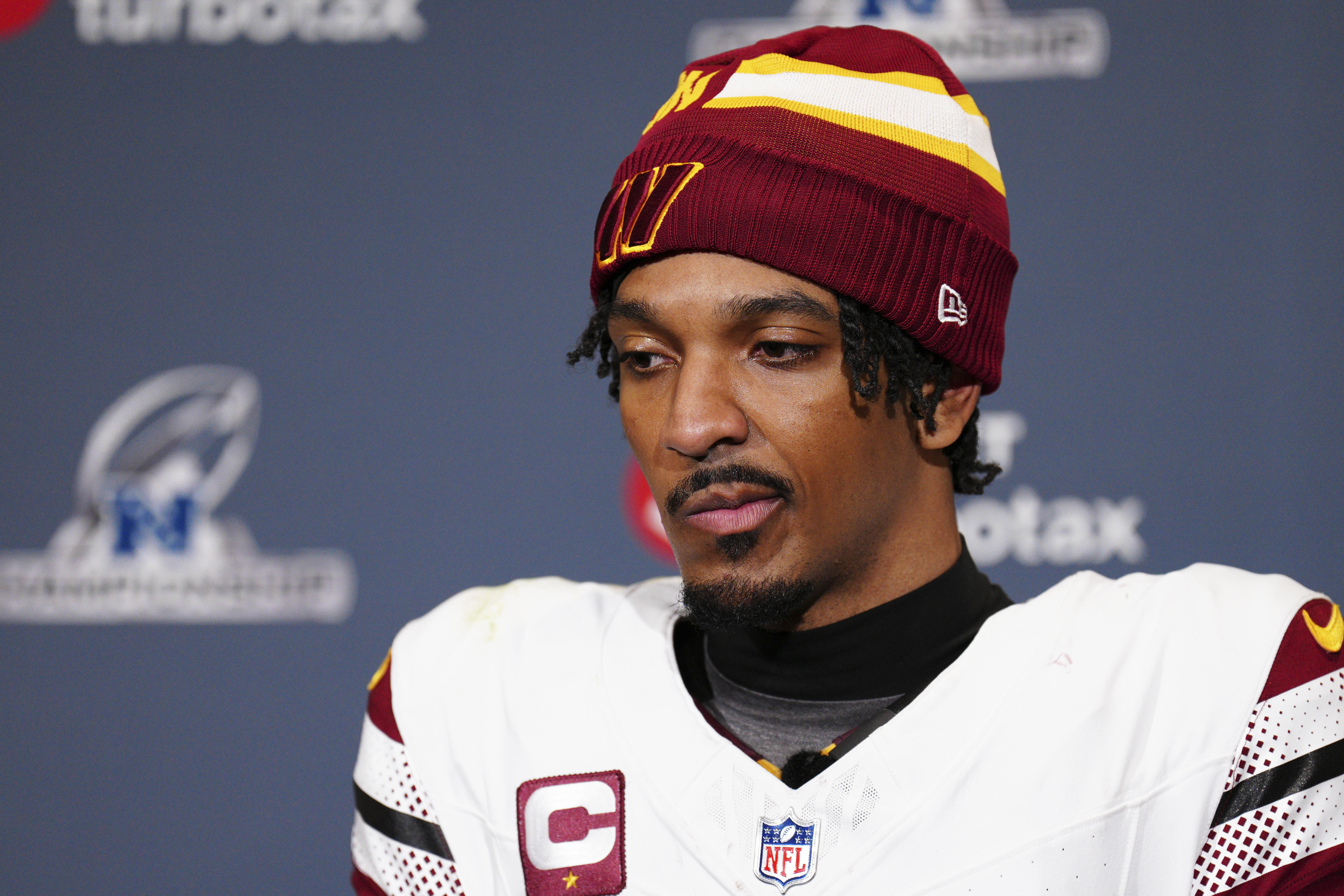 Washington Commanders quarterback Jayden Daniels listens to a question during a news conference after the NFC Championship NFL football game against the Philadelphia Eagles, Sunday, Jan. 26, 2025, in Philadelphia. 