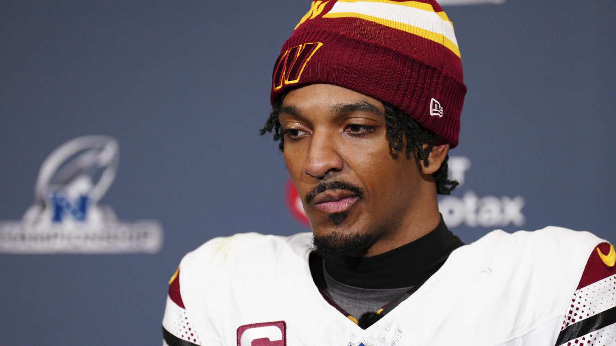 Washington Commanders quarterback Jayden Daniels listens to a question during a news conference after the NFC Championship NFL football game against the Philadelphia Eagles, Sunday, Jan. 26, 2025, in Philadelphia.
