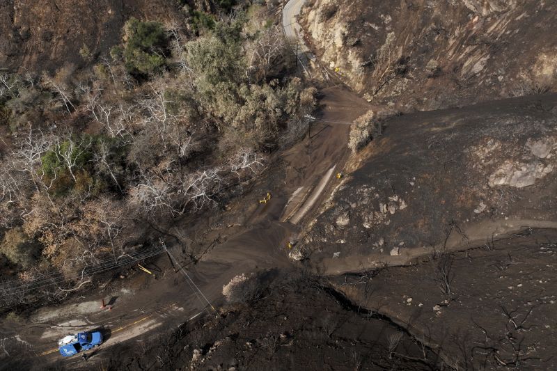 Mud covers Topanga Canyon Rd. on the Palisades Fire burn area after a series of weekend storms Monday, near Malibu, Calif.