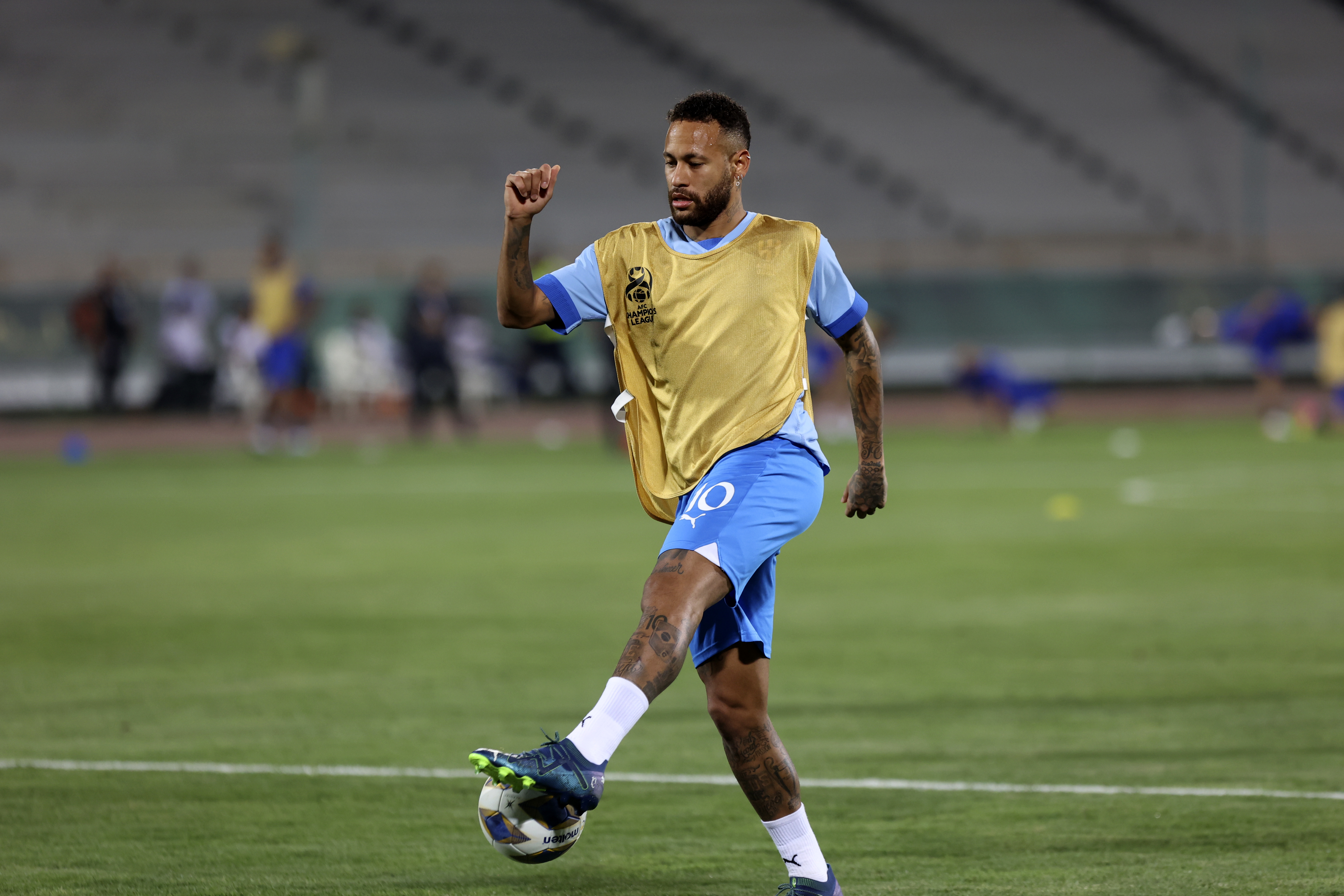 FILE - Al Hilal's Neymar shoots the ball during warm up for the AFC Champions League soccer match against Iran's Nassaji at the Azadi Stadium in Tehran, Iran, Oct. 3, 2023.