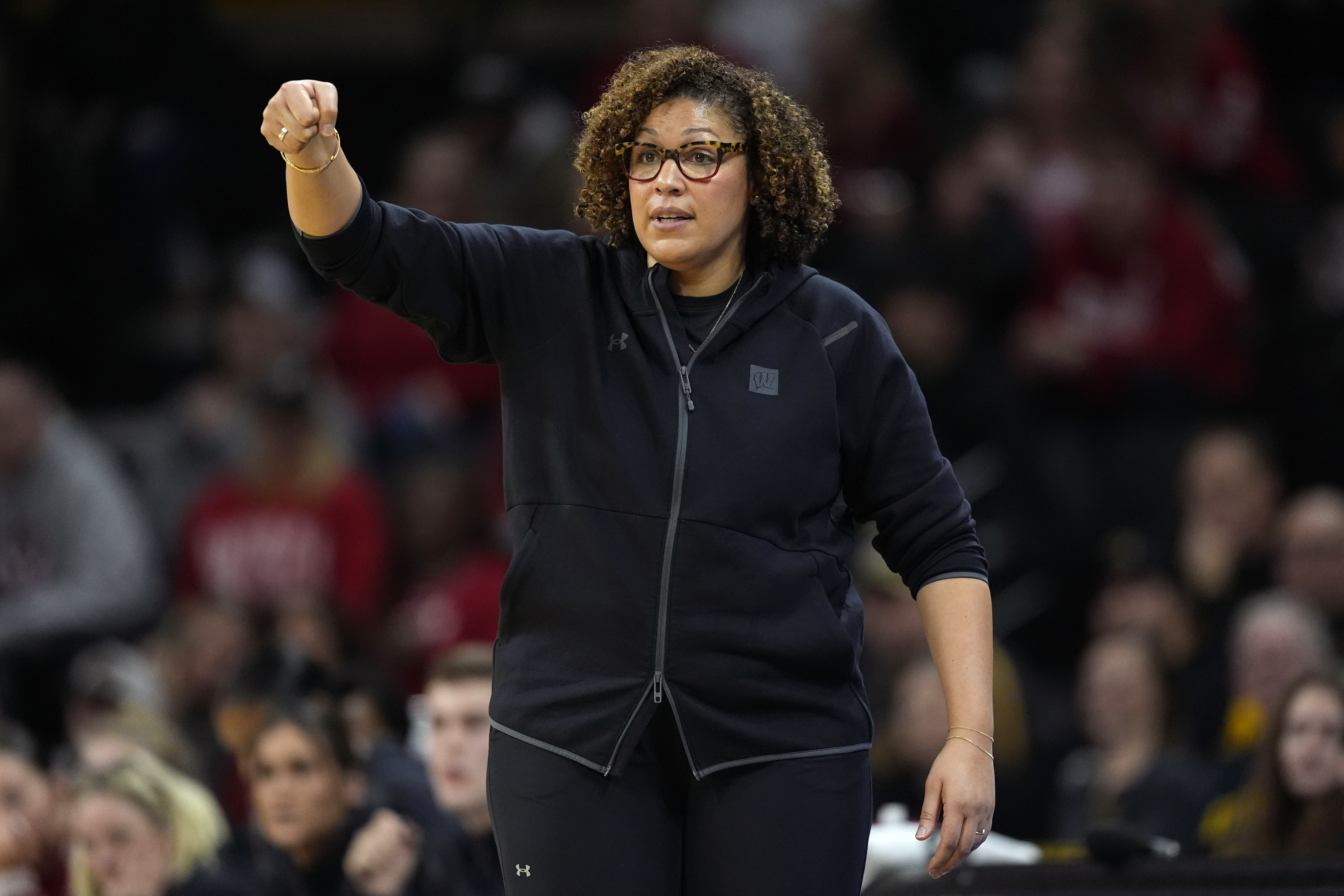 FILE - Wisconsin head coach Marisa Moseley directs her team during the first half of an NCAA college basketball game against Iowa, Jan. 16, 2024, in Iowa City, Iowa. 