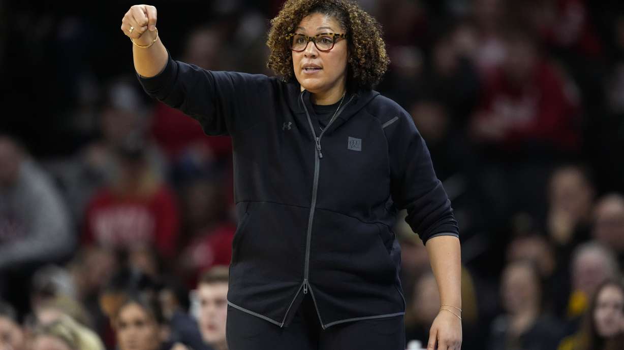 FILE - Wisconsin head coach Marisa Moseley directs her team during the first half of an NCAA college basketball game against Iowa, Jan. 16, 2024, in Iowa City, Iowa.