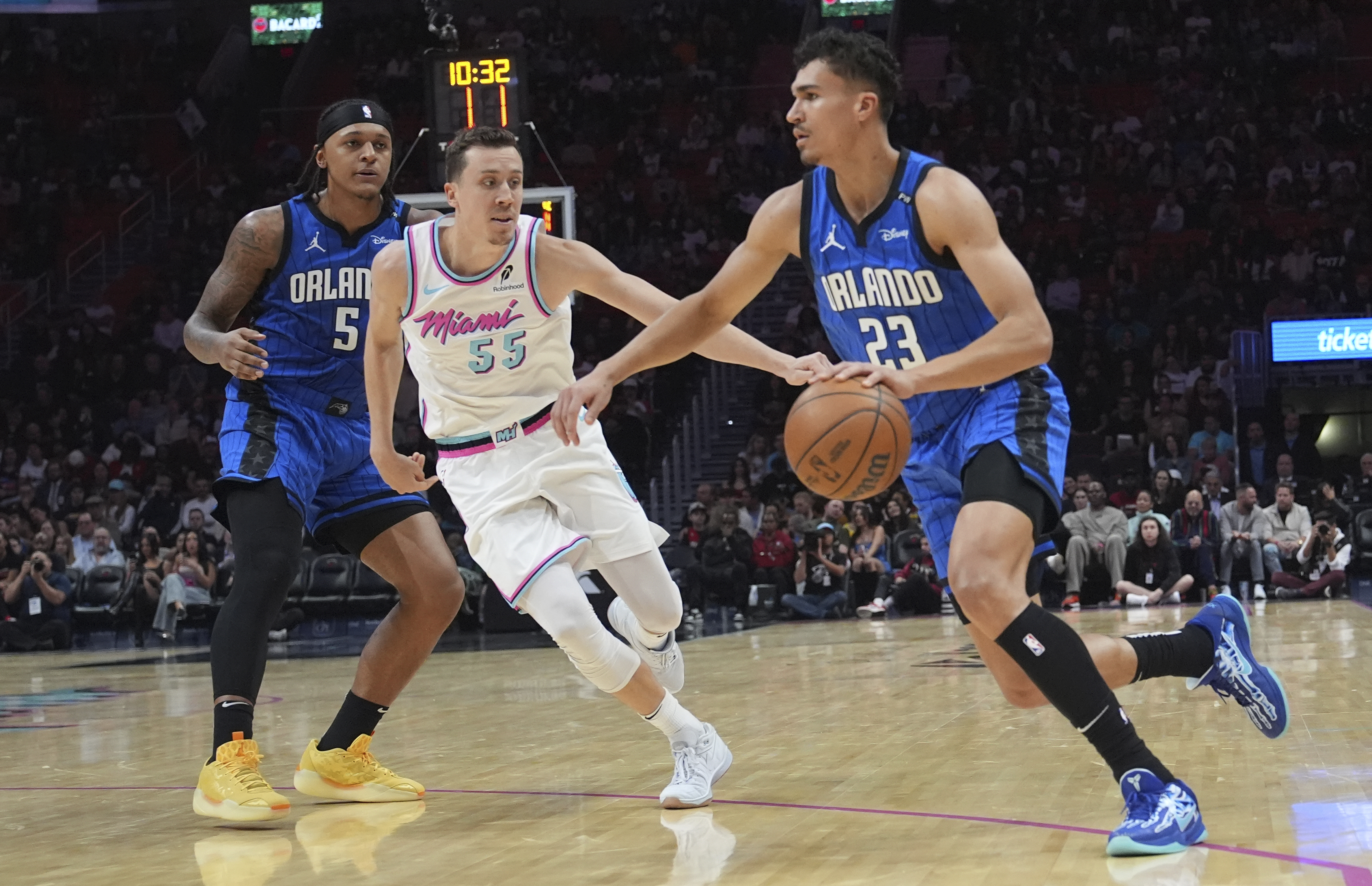 Orlando Magic forward Tristan da Silva (23) drives to the basket as Miami Heat forward Duncan Robinson defends during the first half of an NBA basketball game, Monday, Jan. 27, 2025, in Miami. 