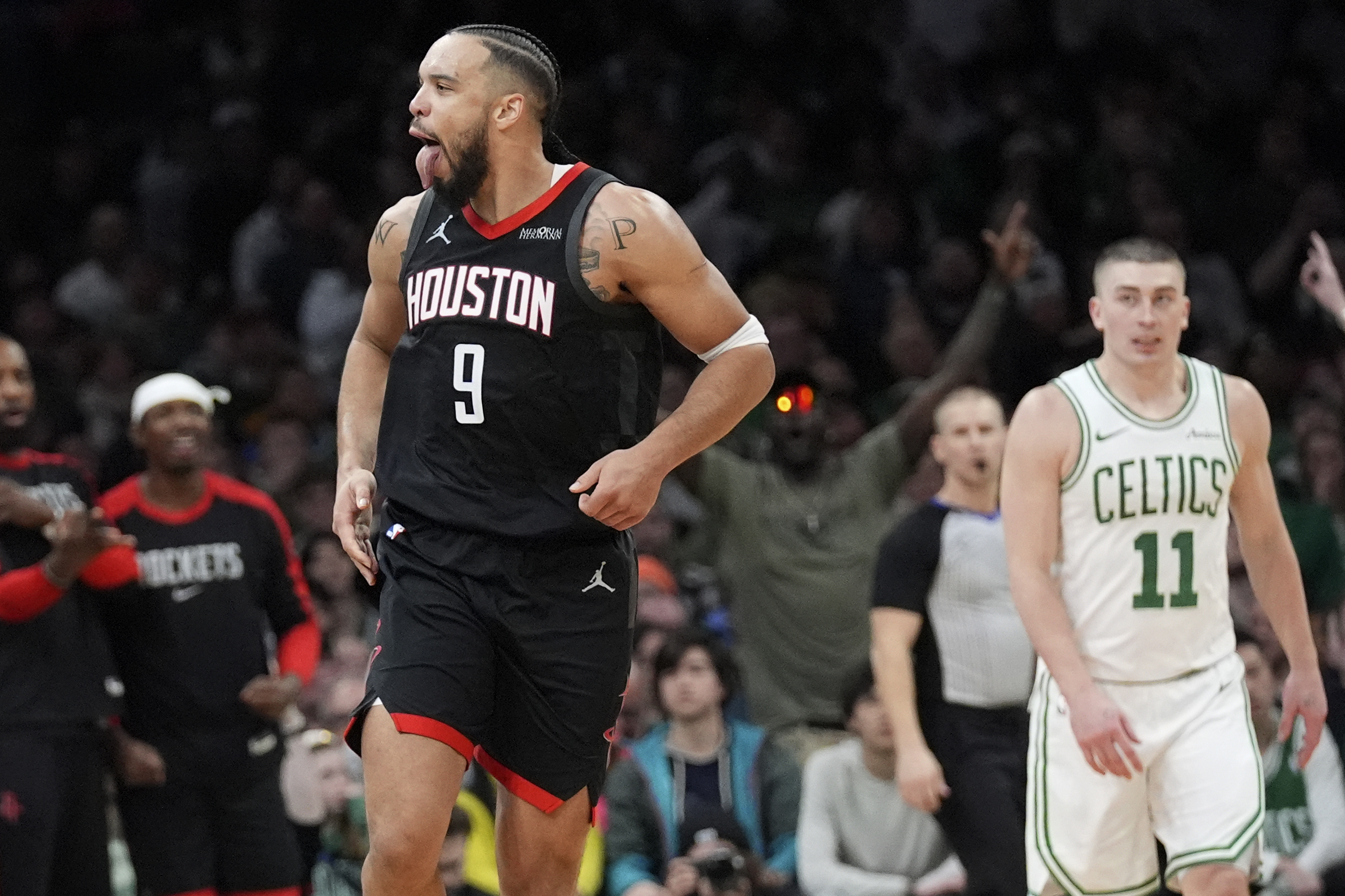 Houston Rockets forward Dillon Brooks (9) celebrates after making a basket against the Boston Celtics during the second half of an NBA basketball game, Monday, Jan. 27, 2025, in Boston. 