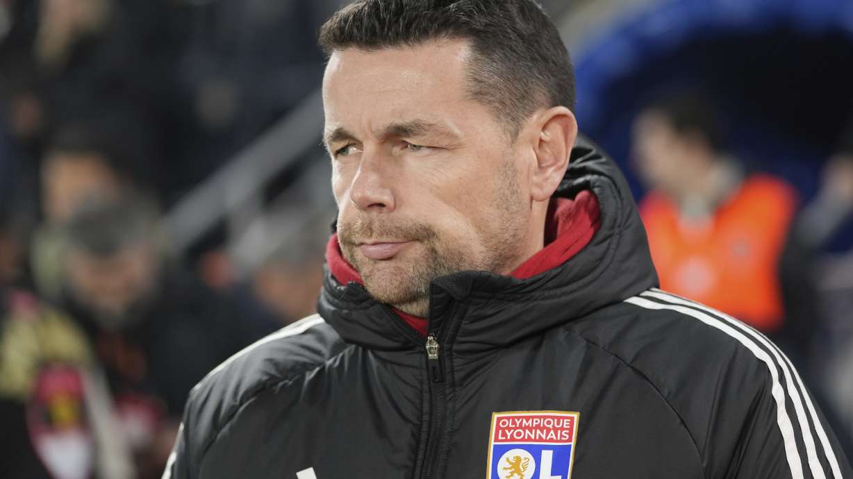Lyon's head coach Pierre Sage waits for the beginning of he Europa League opening phase soccer match against Fenerbahce at Sukru Saracoglu stadium in Istanbul, Turkey, Thursday, Jan. 23, 2025.