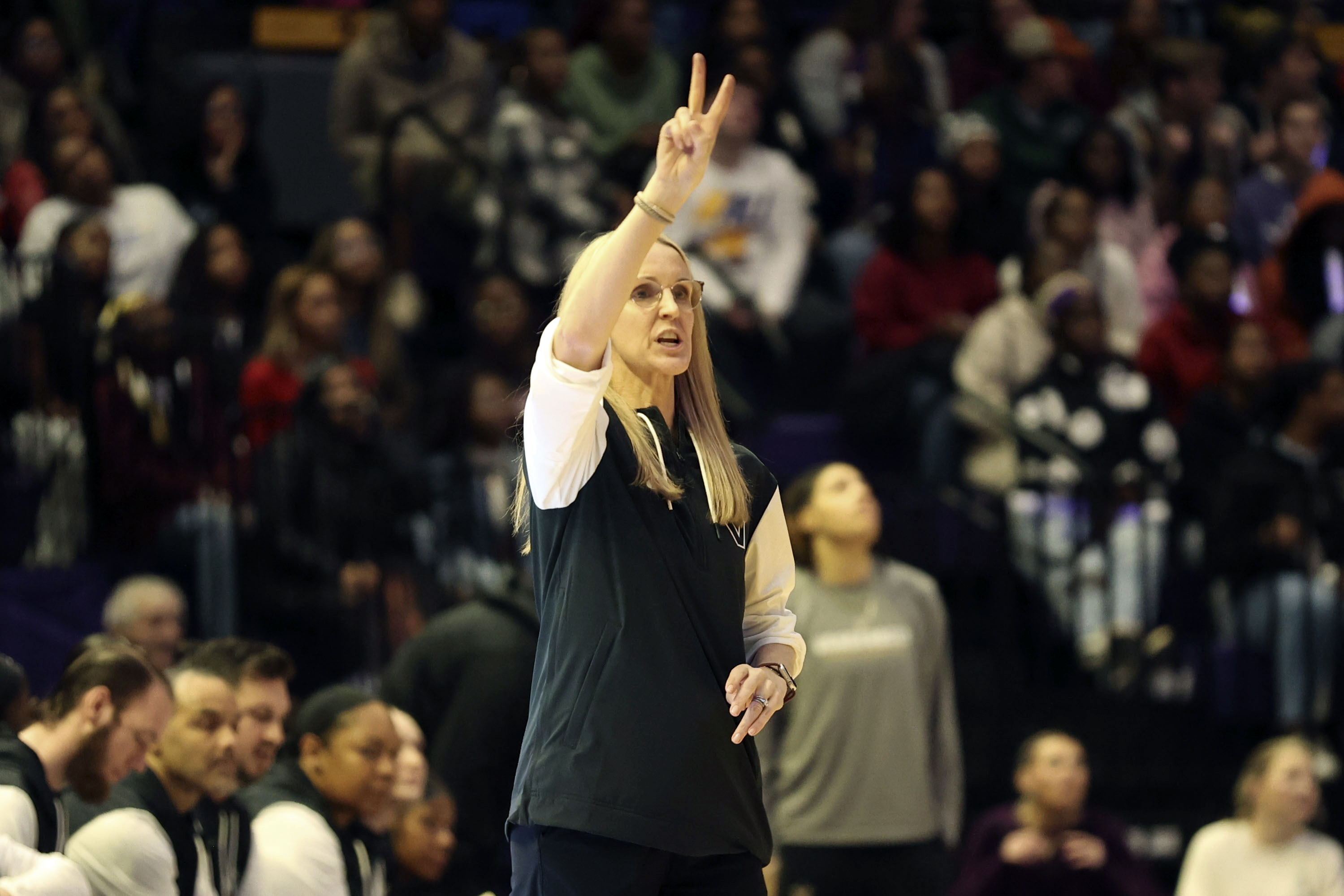 Vanderbilt head coach Shea Ralph calls plays to her team on the floor during the first half of an NCAA college basketball game against LSU in Baton Rouge, La., Monday, Jan. 13, 2025.