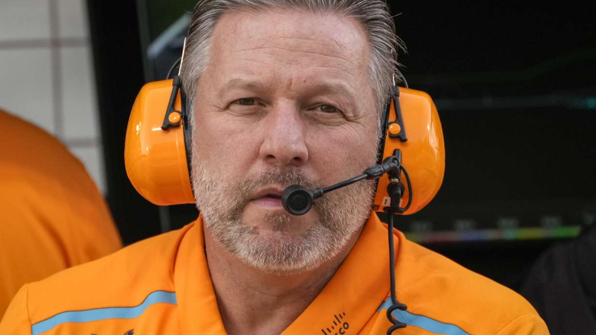 FILE - McLaren chief Zak Brown looks at the garages during a Formula One preseason test at the Bahrain International Circuit in Sakhir, Bahrain, Feb. 23, 2024.