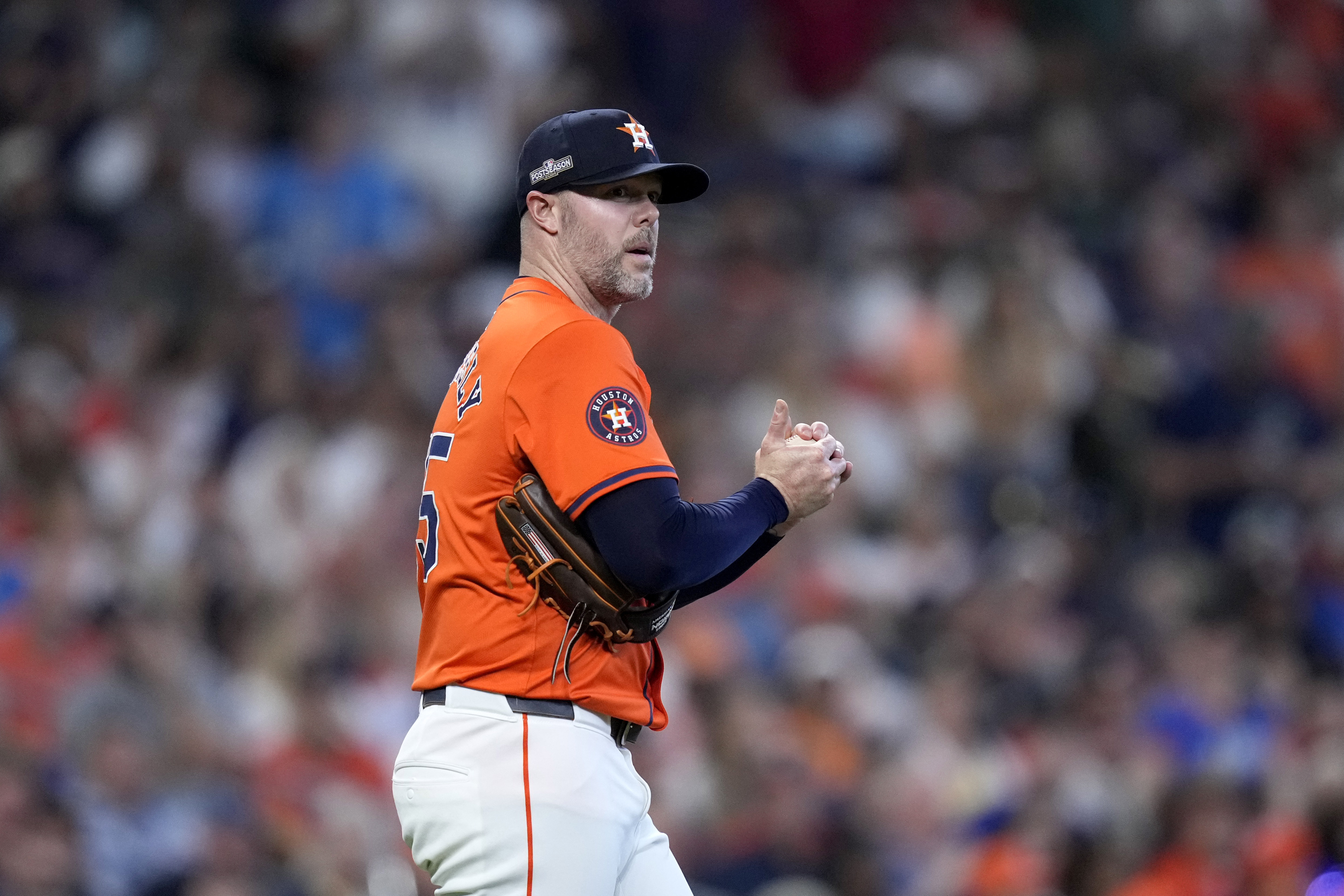 FILE - Houston Astros relief pitcher Ryan Pressly walks back onto the mound after throwing a wild pitch that allowed Detroit Tigers' Kerry Carpenter to score in the eighth inning of Game 2 of an AL Wild Card Series baseball game, Oct. 2, 2024, in Houston.