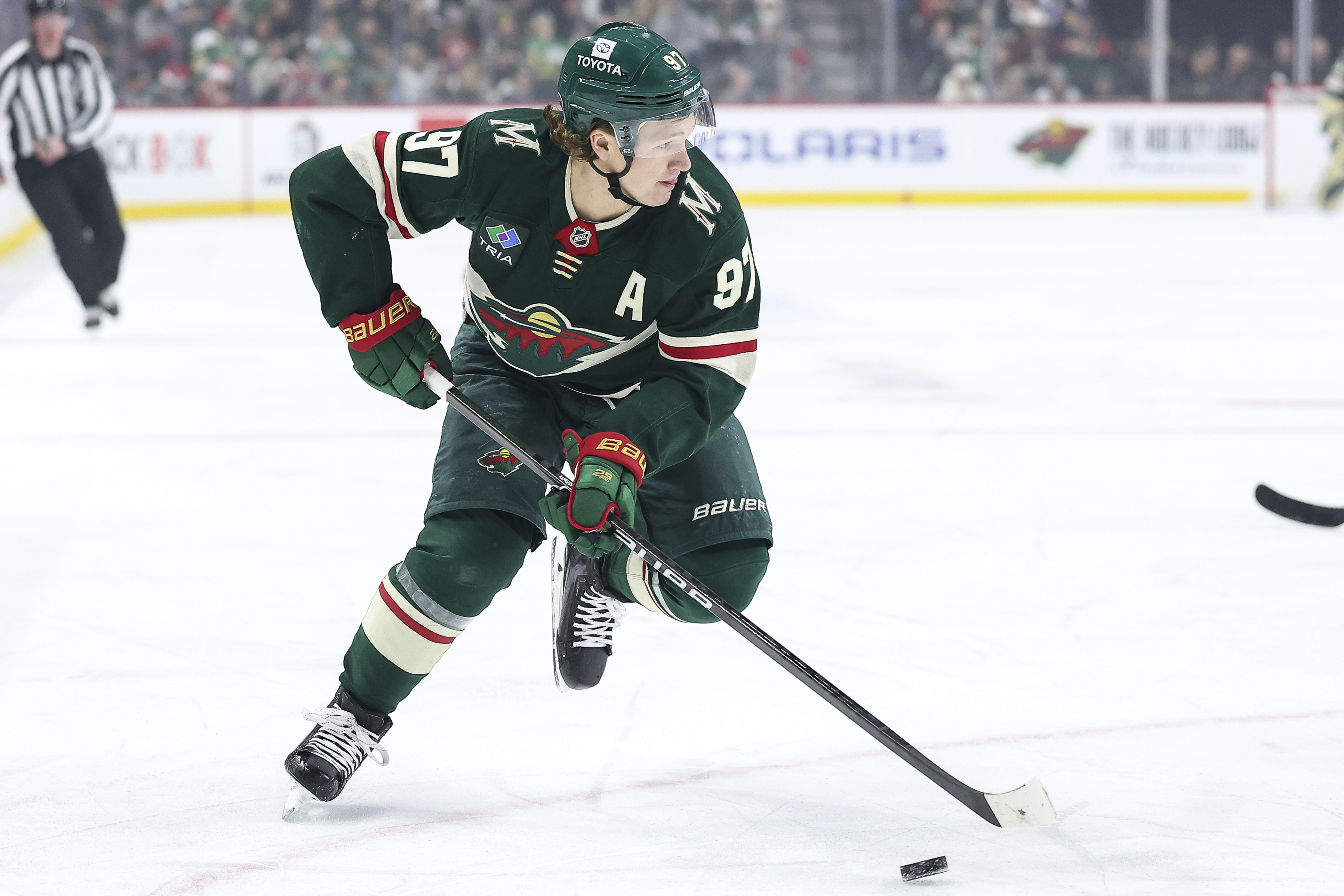 FILE - Minnesota Wild left wing Kirill Kaprizov (97) skates with the puck during the first period of an NHL hockey game against the Utah Hockey Club Friday, Dec. 20, 2024, in St. Paul, Minn. 