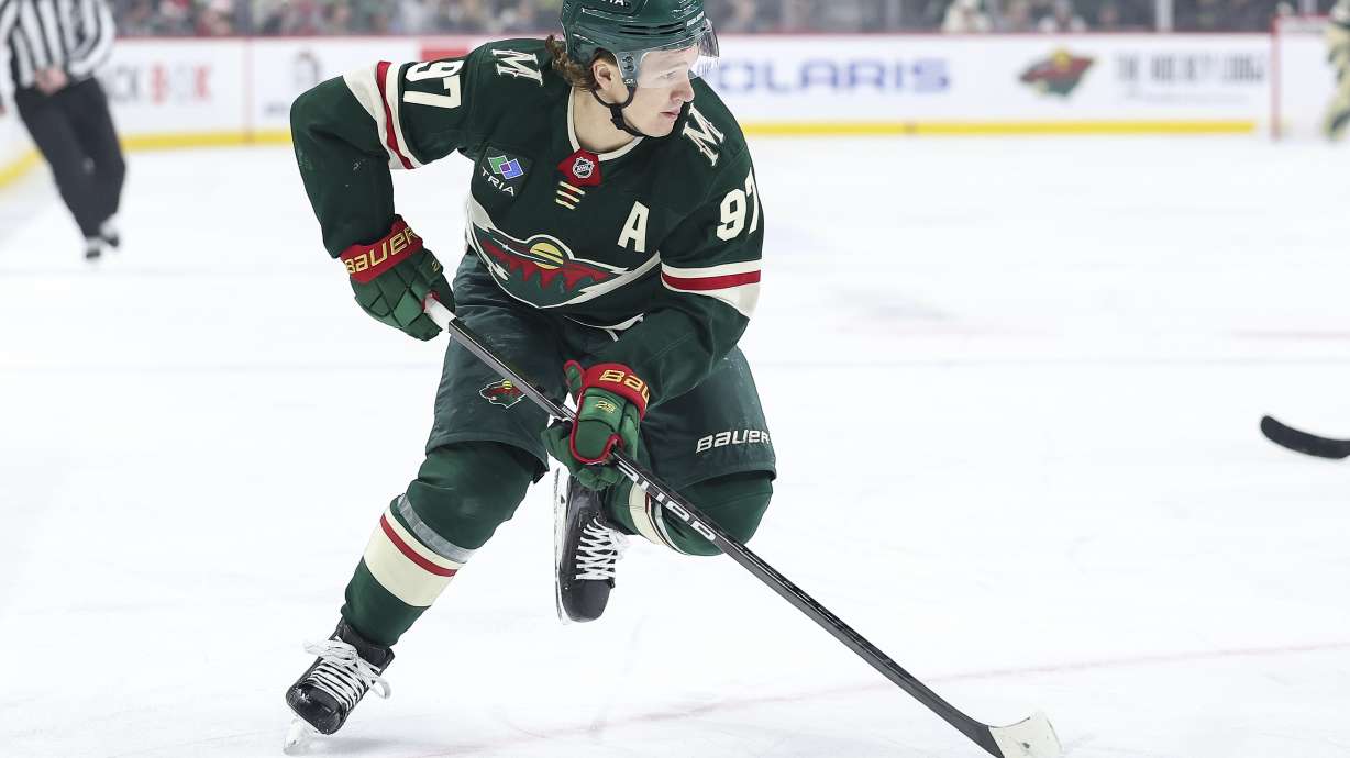 FILE - Minnesota Wild left wing Kirill Kaprizov (97) skates with the puck during the first period of an NHL hockey game against the Utah Hockey Club Friday, Dec. 20, 2024, in St. Paul, Minn.