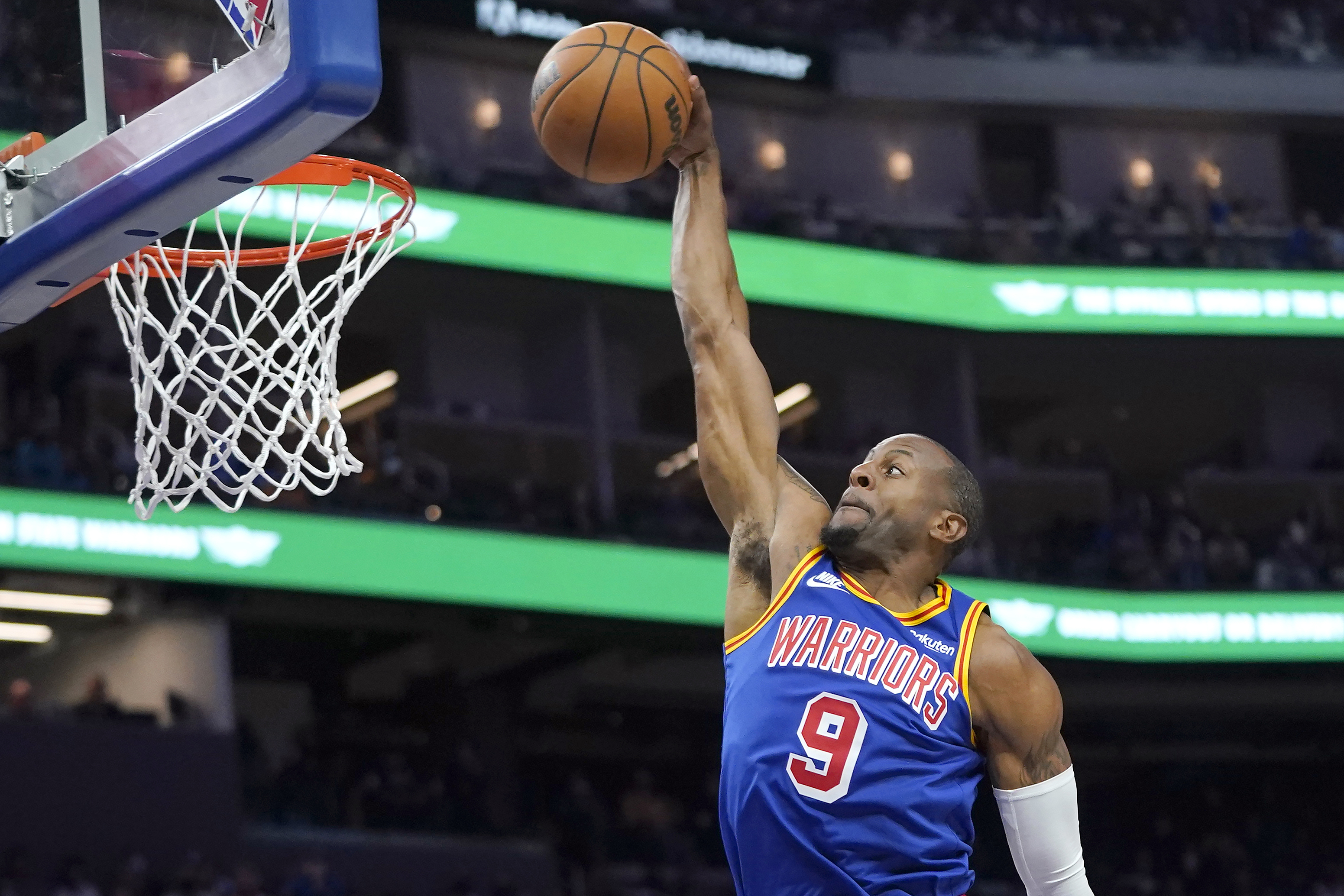 FILE - Golden State Warriors forward Andre Iguodala (9) dunks against the Chicago Bulls during the second half of an NBA basketball game in San Francisco, Friday, Nov. 12, 2021. 
