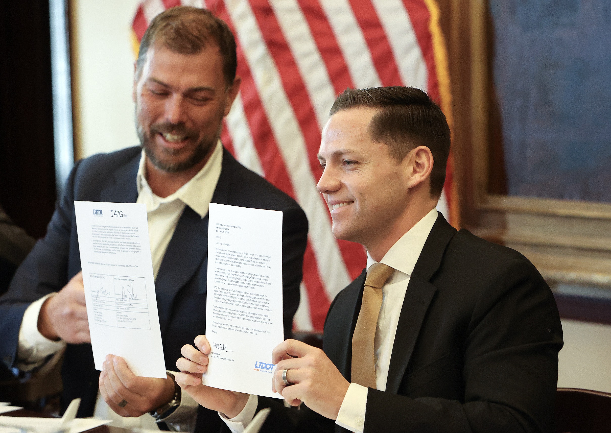 Kyle Clark, Beta Technologies CEO and founder, and Aaron Starks, 47G president and CEO, sign a memorandum of understanding with Beta Technologies, an industry-leading electric aircraft and charging manufacturer, and 47G Utah Aerospace & Defense at the state Capitol in Salt Lake City on Tuesday. The agreement aims to provide an electric air transportation system to reduce commute times, increase access to rural communities and improve air quality.