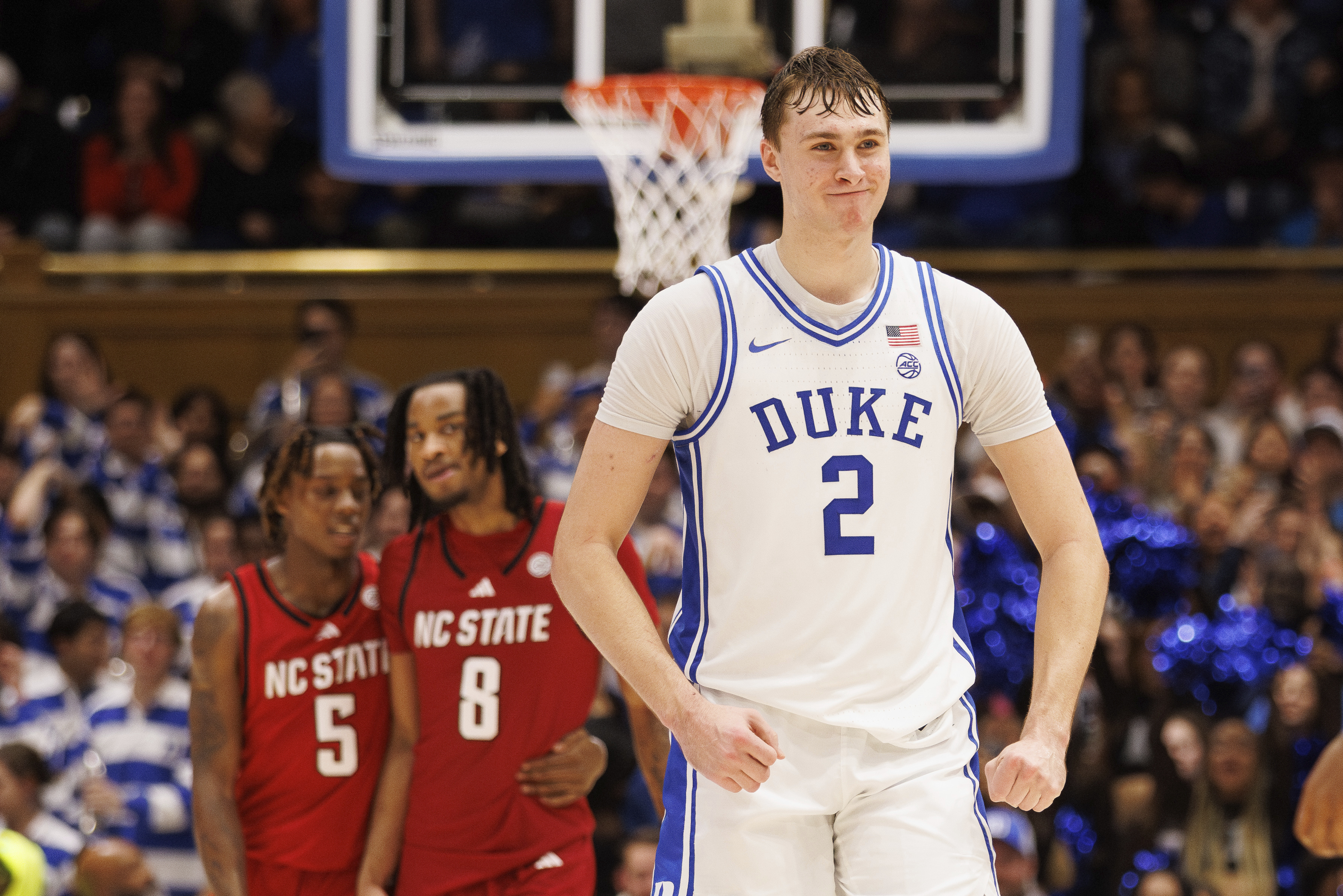 Duke's Cooper Flagg (2) celebrates ahead of North Carolina State's Trey Parker (5) and Jayden Taylor (8) late in the second half of an NCAA college basketball game in Durham, N.C. Monday, Jan. 27, 2025. 