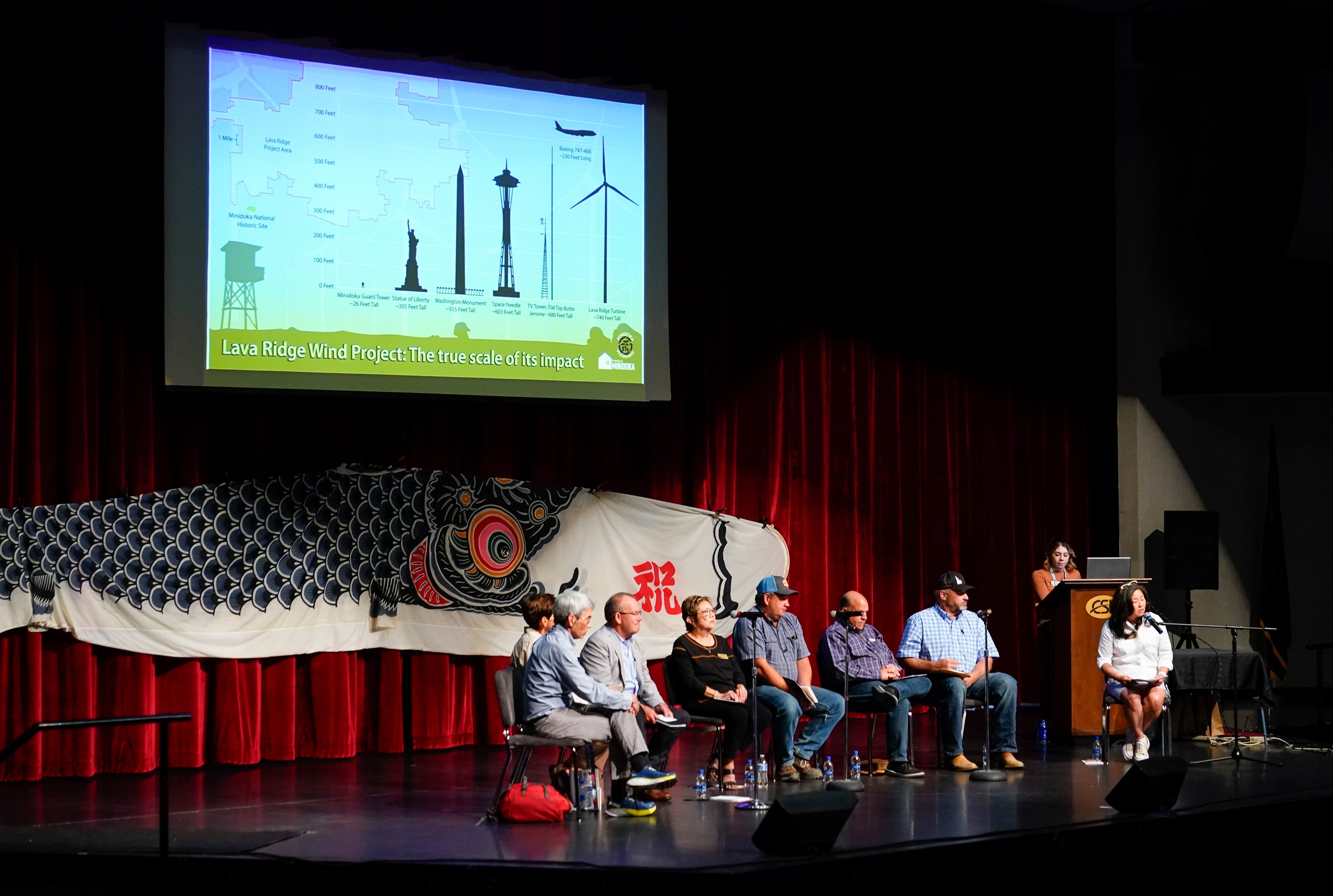 Friends of Minidoka executive director Robyn Achilles, seated at far right, leads a panel of farmers, legislators and camp survivor descendants to discuss the Lava Ridge wind farm project proposed to be built near Minidoka National Historic Site at the College of Southern Idaho, July 7, 2023, in Twin Falls, Idaho. The federal Bureau of Land Management’s preferred alternative for a proposed large-scale wind energy farm in southern Idaho would shrink its size by nearly half and move it farther from a national historic site.