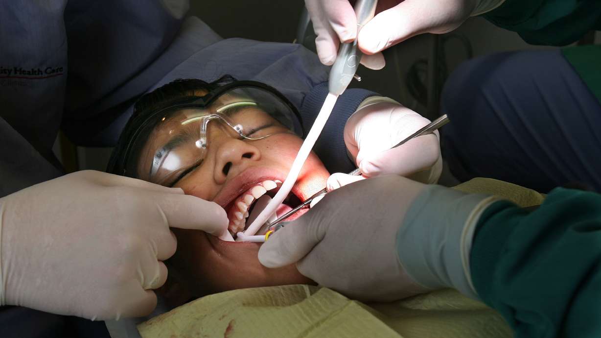 Dentist Spencer Luke seals Paulina Orozco's teeth, Feb 24, 2007. On Feb. 6, Fortis College in Salt Lake City will host a Give Kids a Smile event, providing local children with free dental care and information about the importance of oral health.