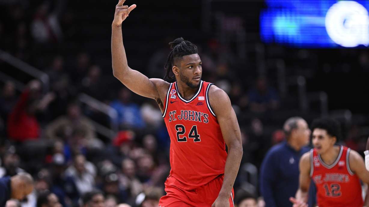 St. John's forward Zuby Ejiofor (24) gestures after he made a 3-point basket during the first half of an NCAA college basketball game against Georgetown, Tuesday, Jan. 28, 2025, in Washington.