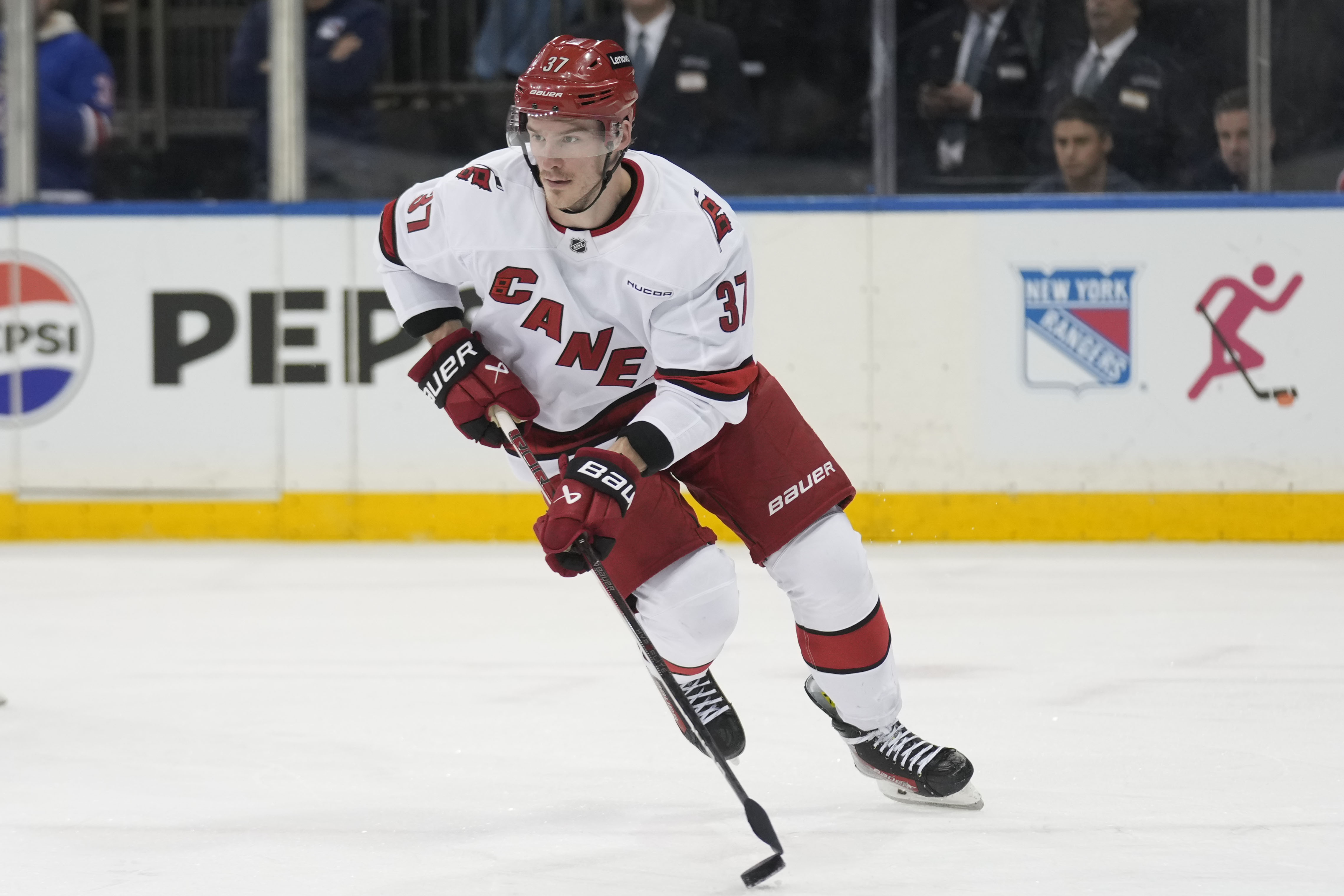 Carolina Hurricanes' Andrei Svechnikov moves the puck up the ice during the second period of an NHL hockey game against the New York Rangers, Tuesday, Jan. 28, 2025, in New York. 