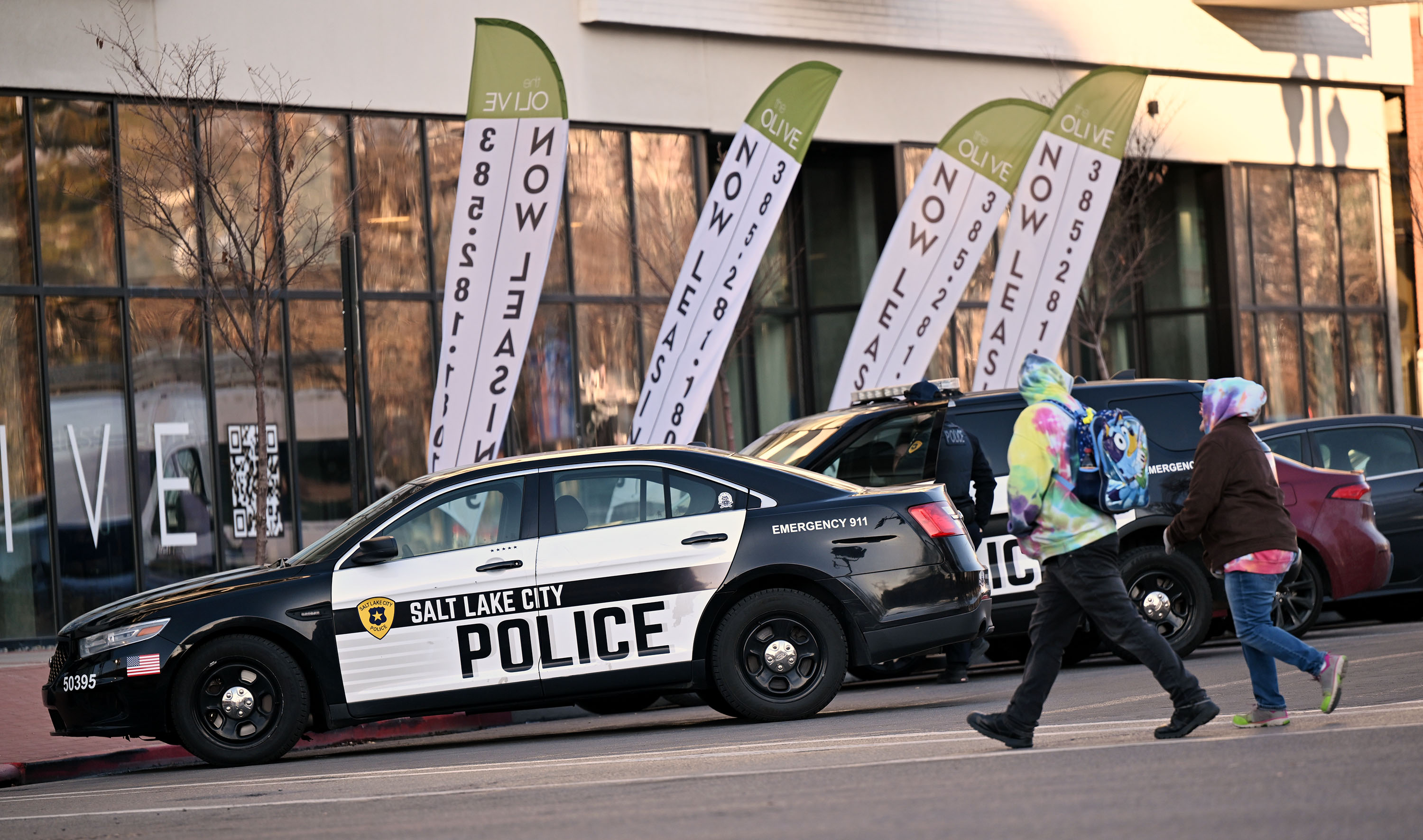 Salt Lake City Police respond to a call at The Olive Apartments near Pioneer Park in Salt Lake City on Tuesday.