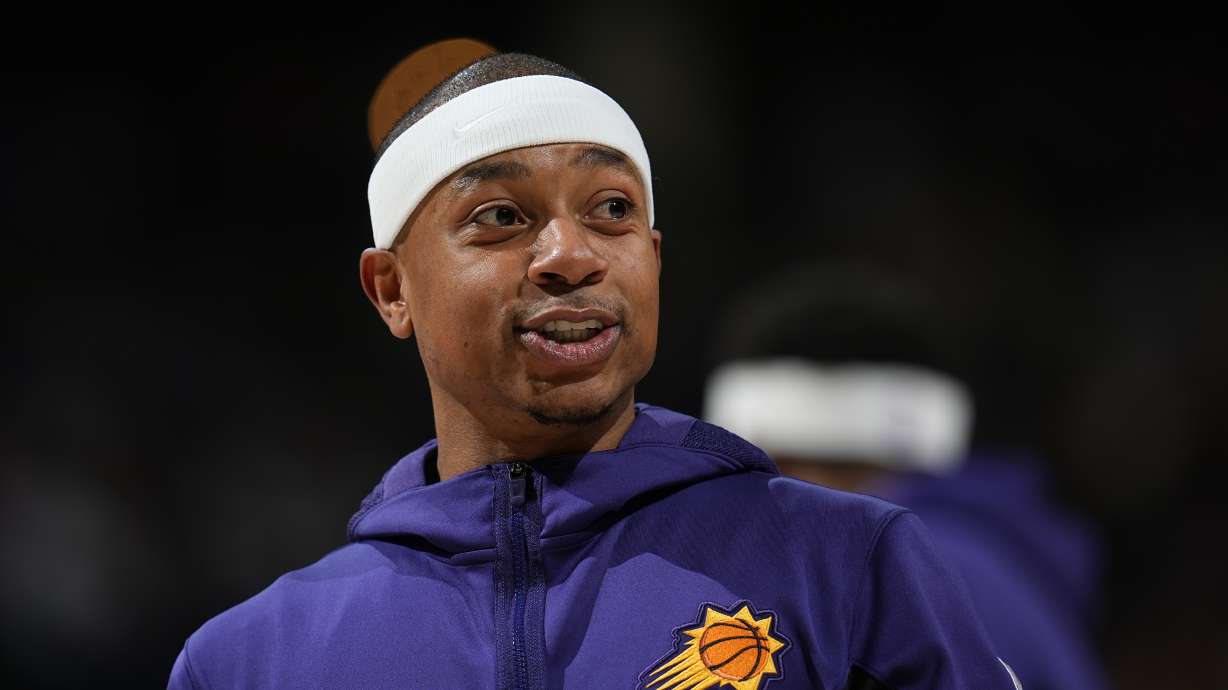 FILE - Phoenix Suns guard Isaiah Thomas looks on in the first half of an NBA basketball game, March 27, 2024, in Denver.