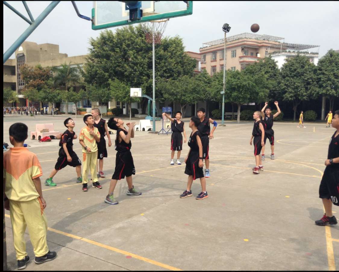Mason and Gabe Madsen as fifth graders play basketball in China.