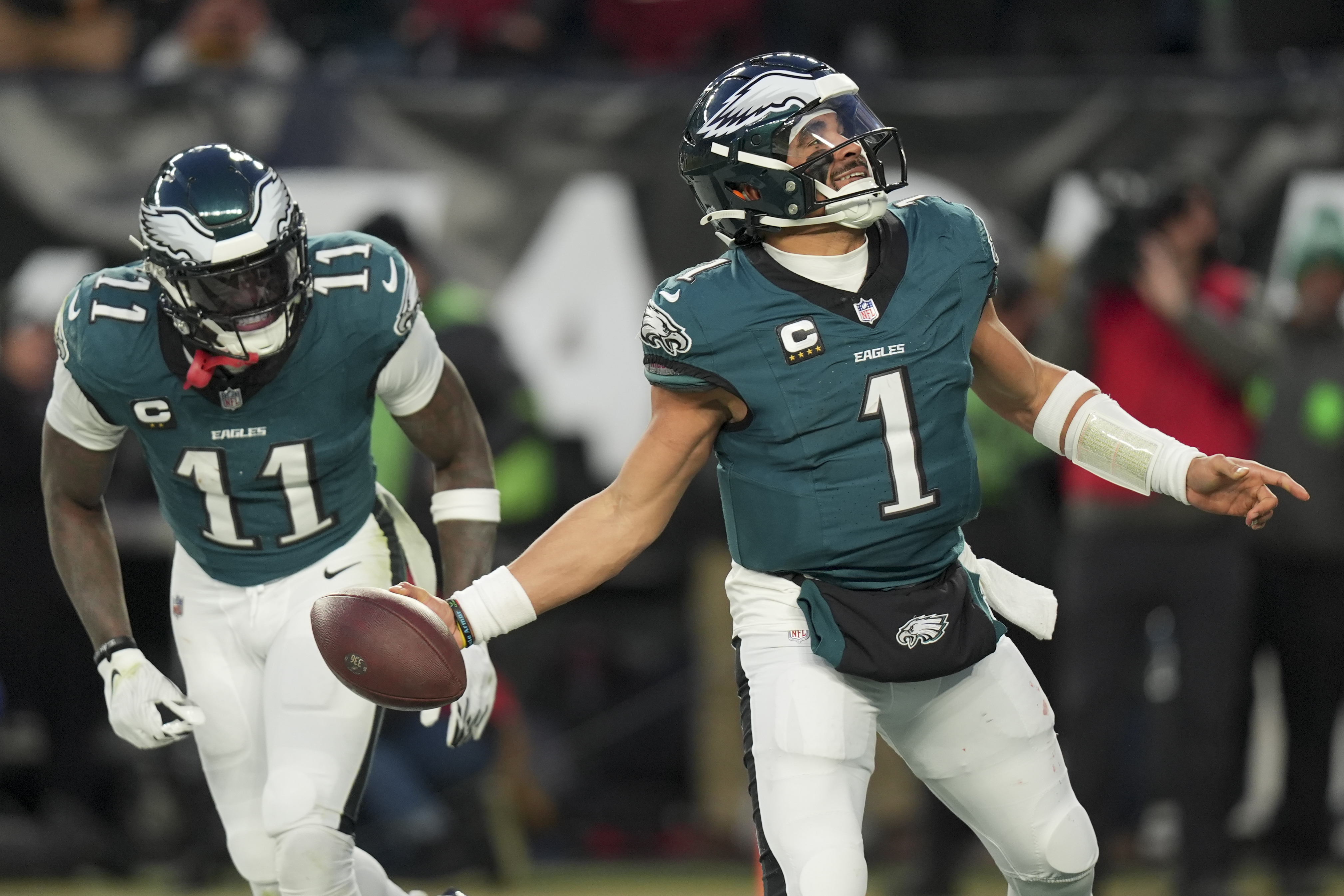 Philadelphia Eagles quarterback Jalen Hurts celebrates after scoring against the Washington Commanders during the second half of the NFC Championship NFL football game, Sunday, Jan. 26, 2025, in Philadelphia.