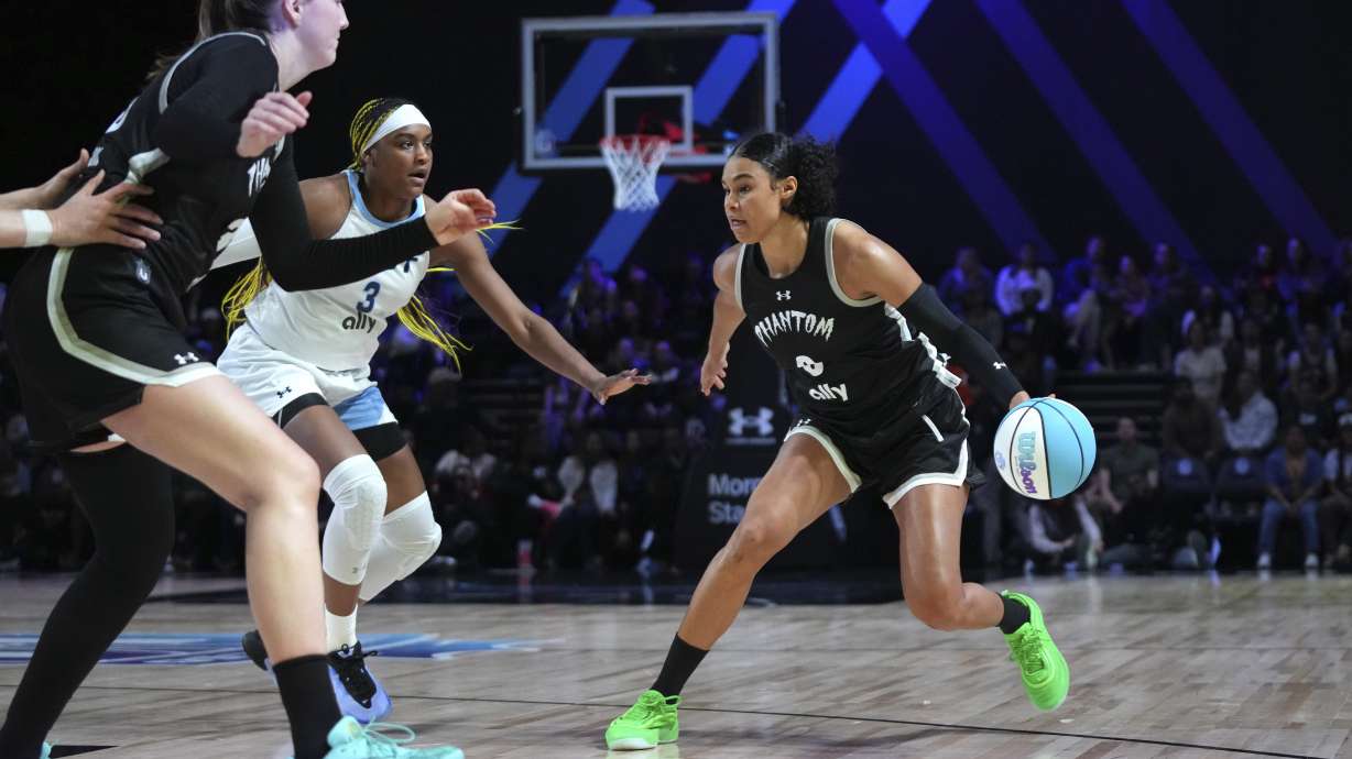 Phantom forward Satou Sabally (0) drives to the basket as Mist forward Aaliyah Edwards (3) defends during the second half of an Unrivaled 3-on-3 basketball game Friday, Jan. 24, 2025, in Medley, Fla.