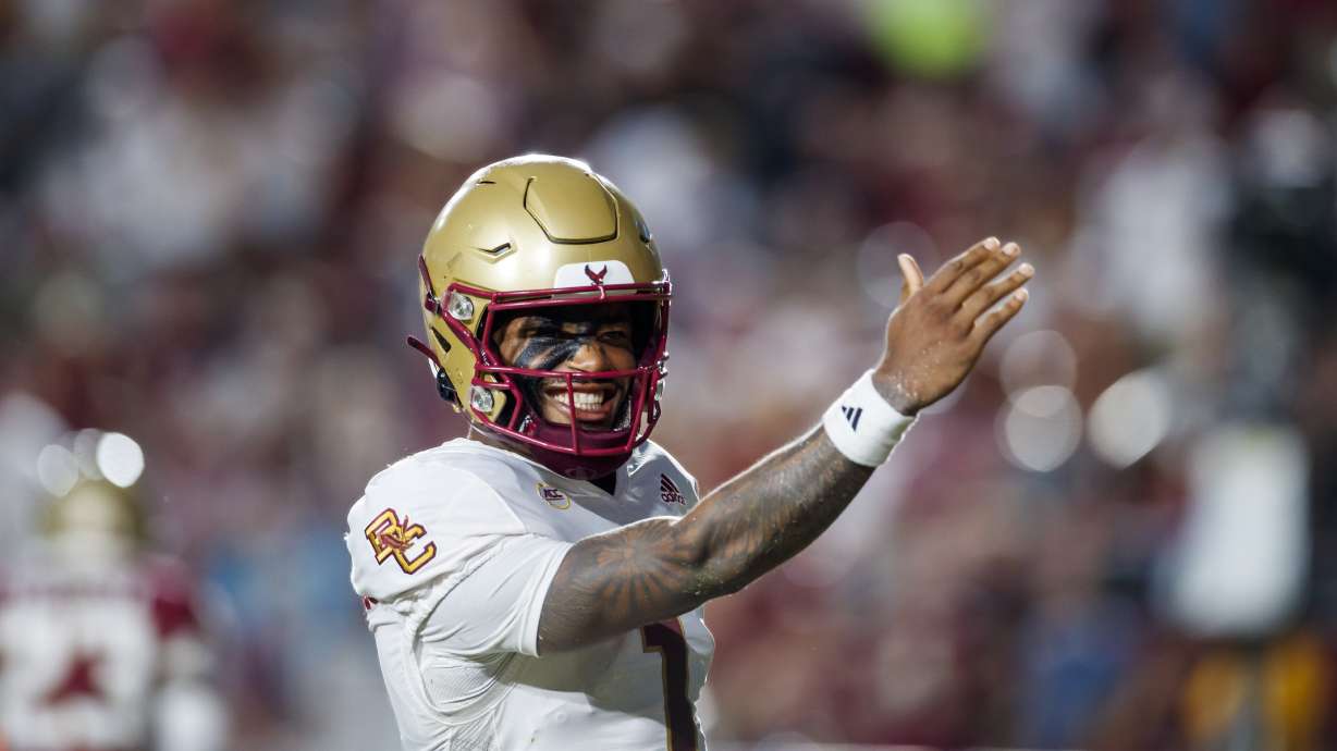 FILE - Boston College quarterback Thomas Castellanos celebrates by making a chopping motion with his hand towards Florida State fans after he scored the first touchdown during the first half of an NCAA college football game, Monday, Sept. 2, 2024, in Tallahassee, Fla.