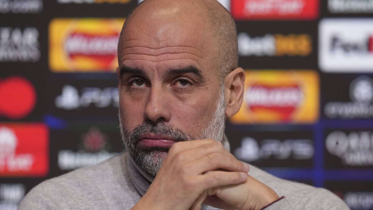 Manchester City manager Pep Guardiola reacts during a press conference at the City Football Academy in Manchester, England, Tuesday Jan. 28, 2025.