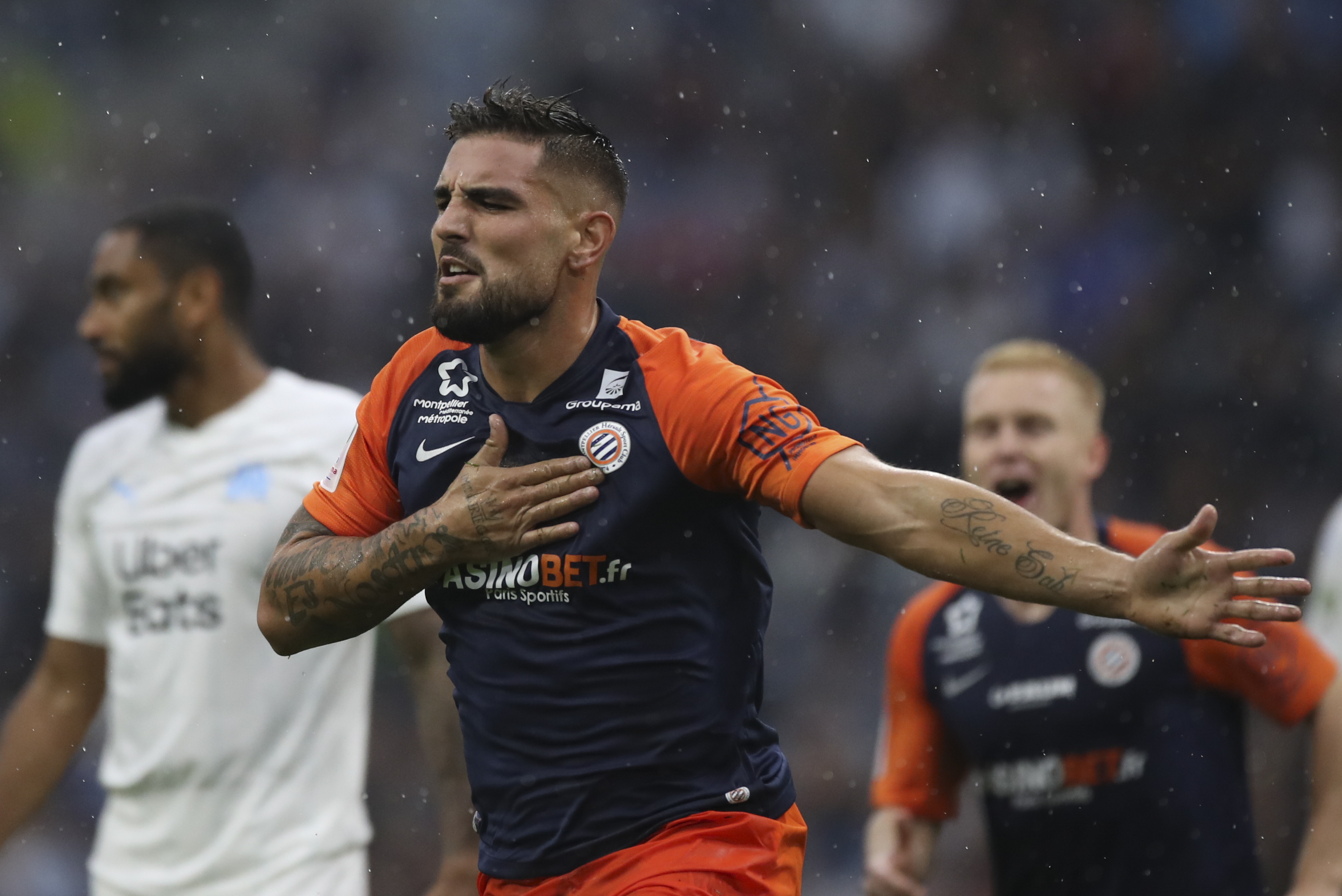 FILE - Montpellier's Andy Delort reacts after scoring the goal during the French League One soccer match between Marseille and Montpellier at the Velodrome stadium in Marseille, southern France, Saturday, Sept. 21, 2019. The goal has not been counted. 