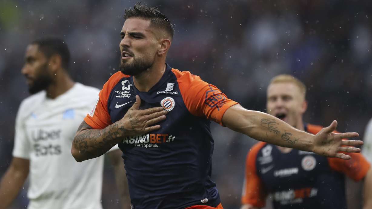 FILE - Montpellier's Andy Delort reacts after scoring the goal during the French League One soccer match between Marseille and Montpellier at the Velodrome stadium in Marseille, southern France, Saturday, Sept. 21, 2019. The goal has not been counted.