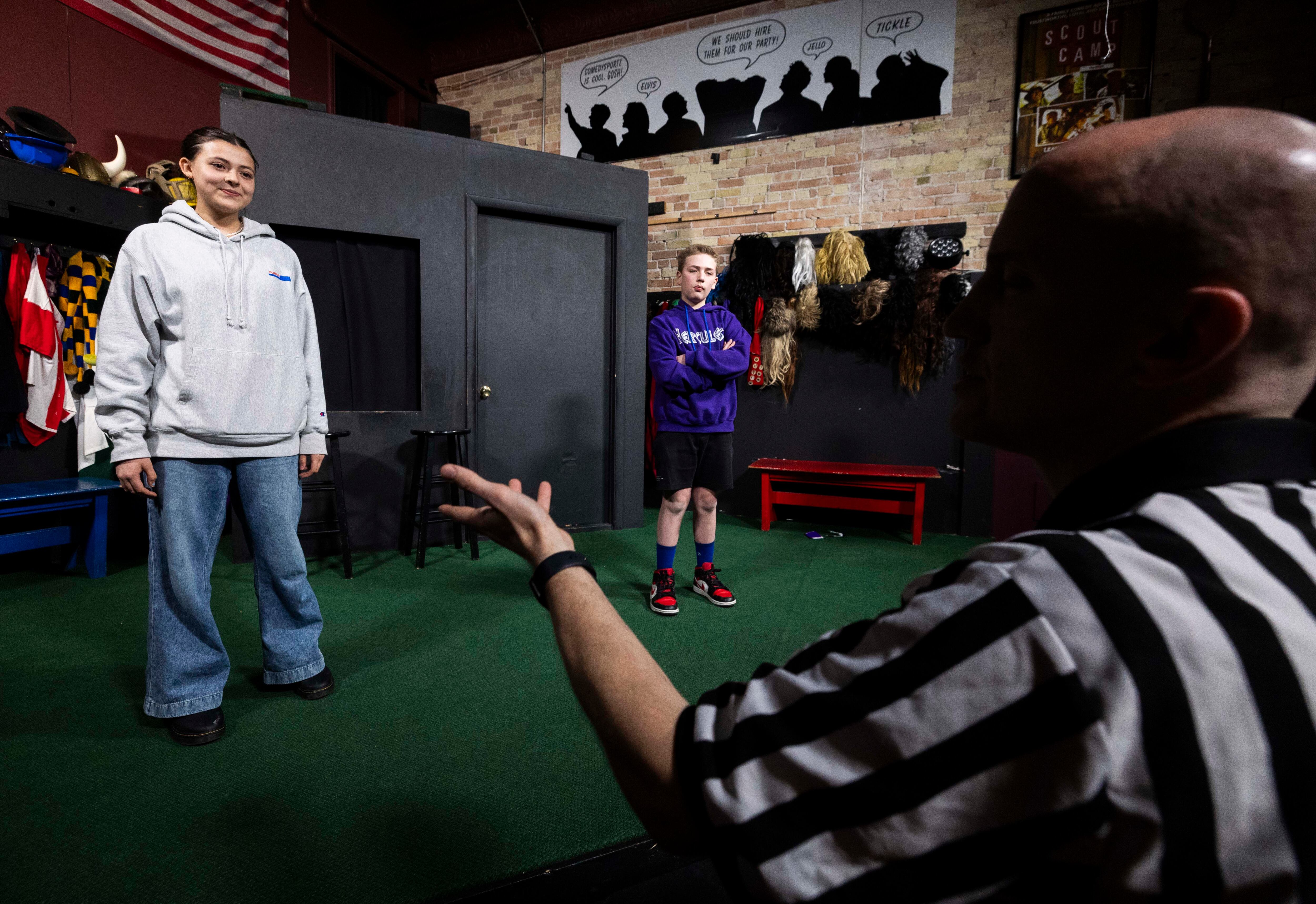 Adelaida Dunn, 15, left, and Korbin Butcher, 12, center, both listen to Improv Academy program director Joey Mascio, right, while he gives advice on how to improve their improvised performances during an Improv Academy Class for homeschooled children at ComedySportz Utah in Provo on Tuesday.