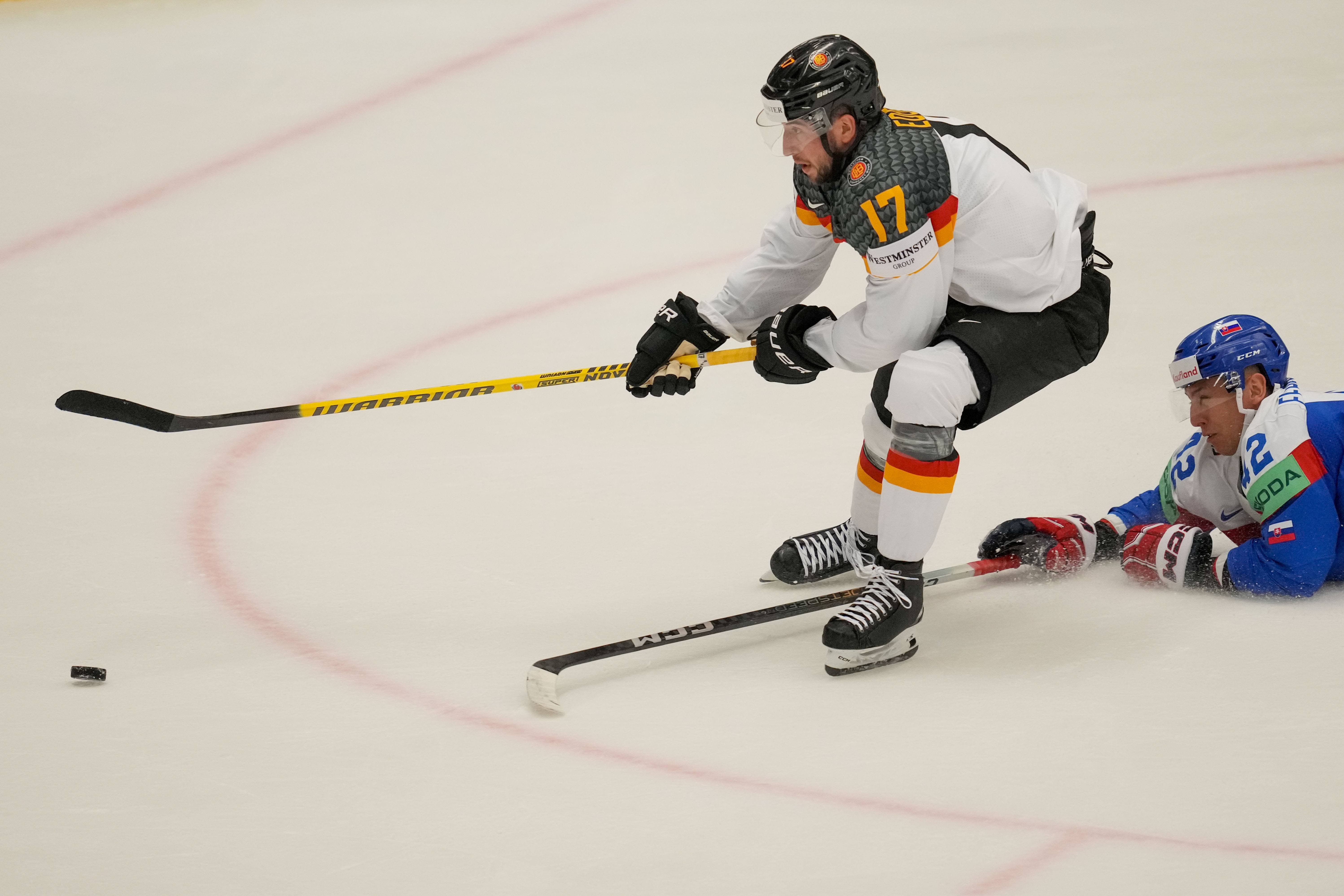 FILE - Germany's Tobias Eder, left, scores his side's sixth goal during the preliminary round match between Slovakia and Germany at the Ice Hockey World Championships in Ostrava, Czech Republic, May 10, 2024. 