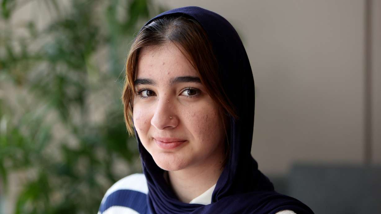 Maram Al-Shammari, a refugee from Iraq, poses for a portrait at the Utah State Bar office in Salt Lake City on Wednesday. She was helped by the Refugee Justice League after she was bullied growing up in Utah.