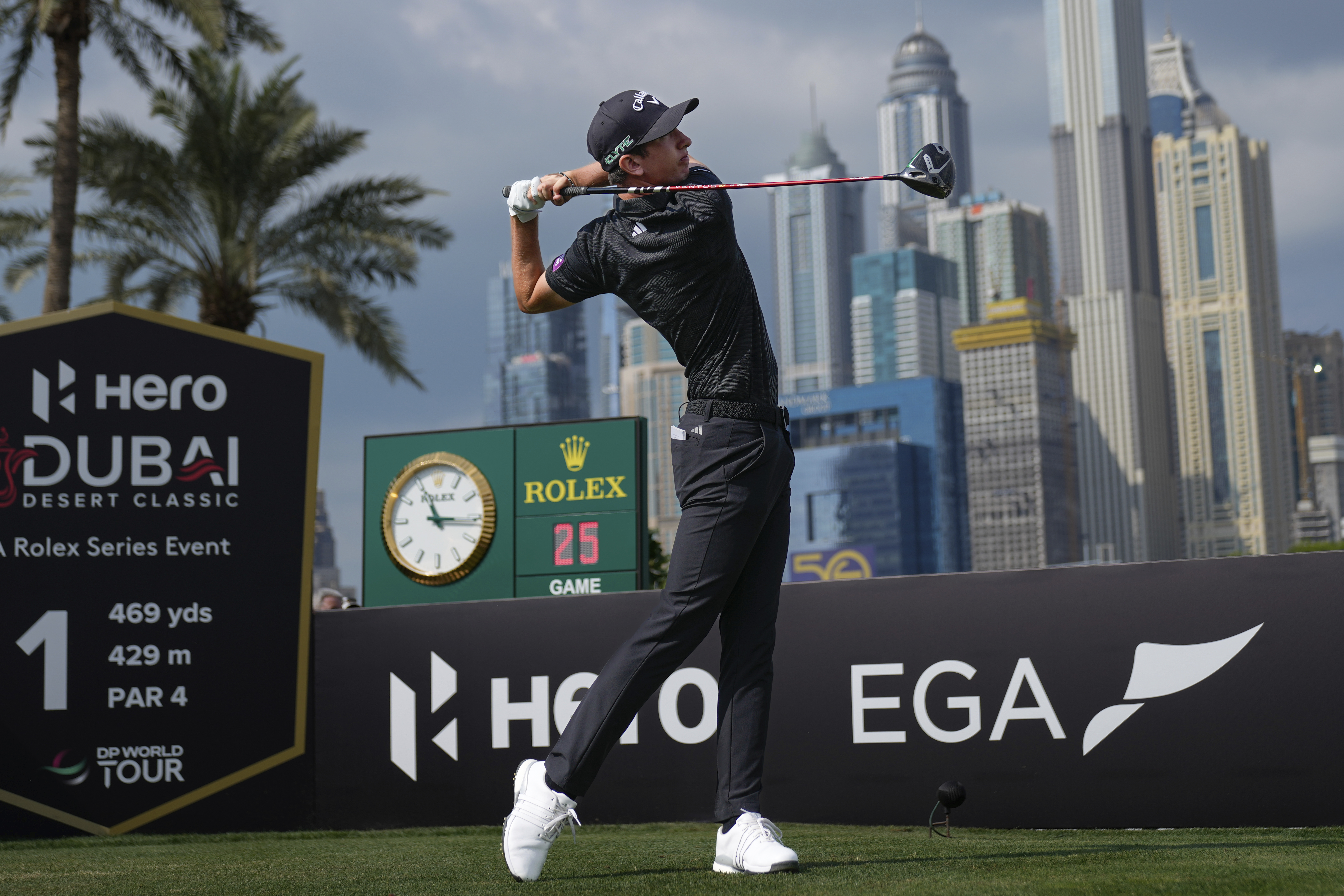 Tom Mckibbin of Northern Ireland hits off the first tee during the final round of the Dubai Desert Classic golf tournament, in Dubai, United Arab Emirates, Sunday, Jan. 19, 2025. 