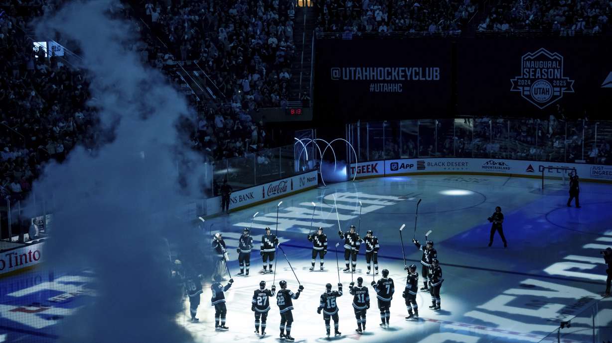 Utah Hockey Club players are announced before an NHL hockey game against the Chicago Blackhawks, Tuesday, Oct. 8, 2024, in Salt Lake City.