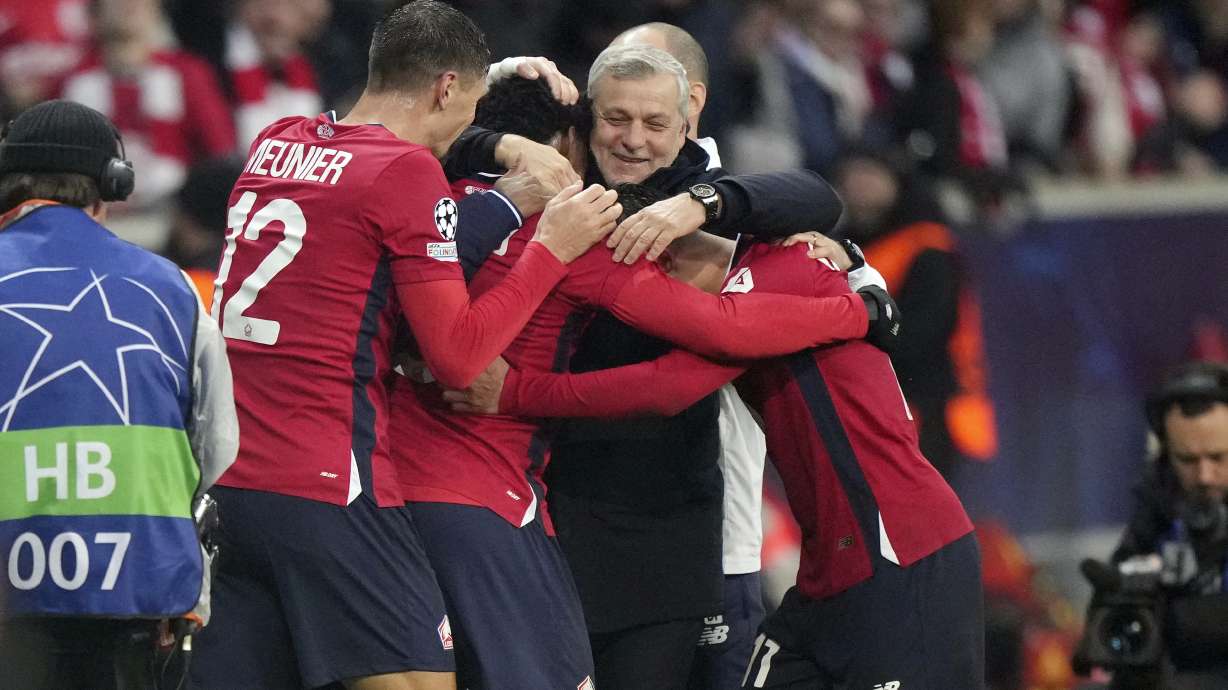 Lille's players and head coach Bruno Genesio celebrate after their fourth goal during the Champions League opening phase soccer match between Lille and Feyenoord at the Stade Pierre Mauroy in Villeneuve-d'Ascq, outside Lille, northern France, Wednesday, Jan. 29, 2025.