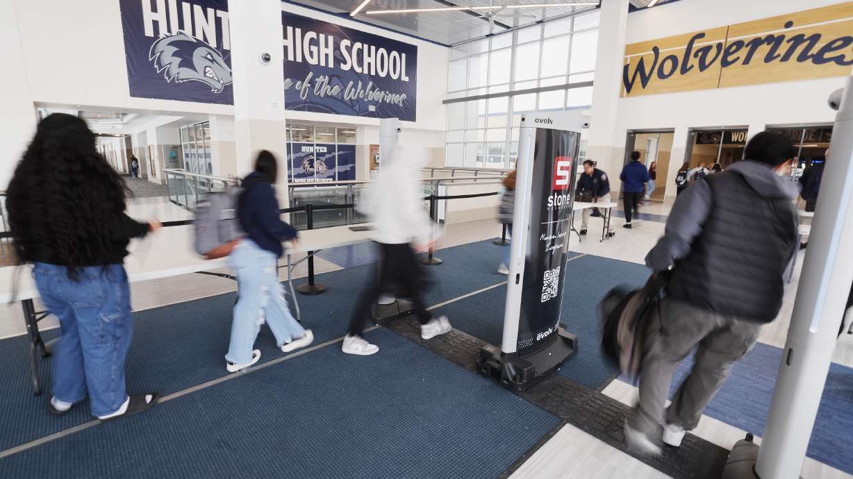 Hunter High School students walk through the scanners on April 4, 2023. The Utah Legislature last year passed a sweeping bill focused on school security, and a successor bill unanimously advanced through a Utah House committee Wednesday.
