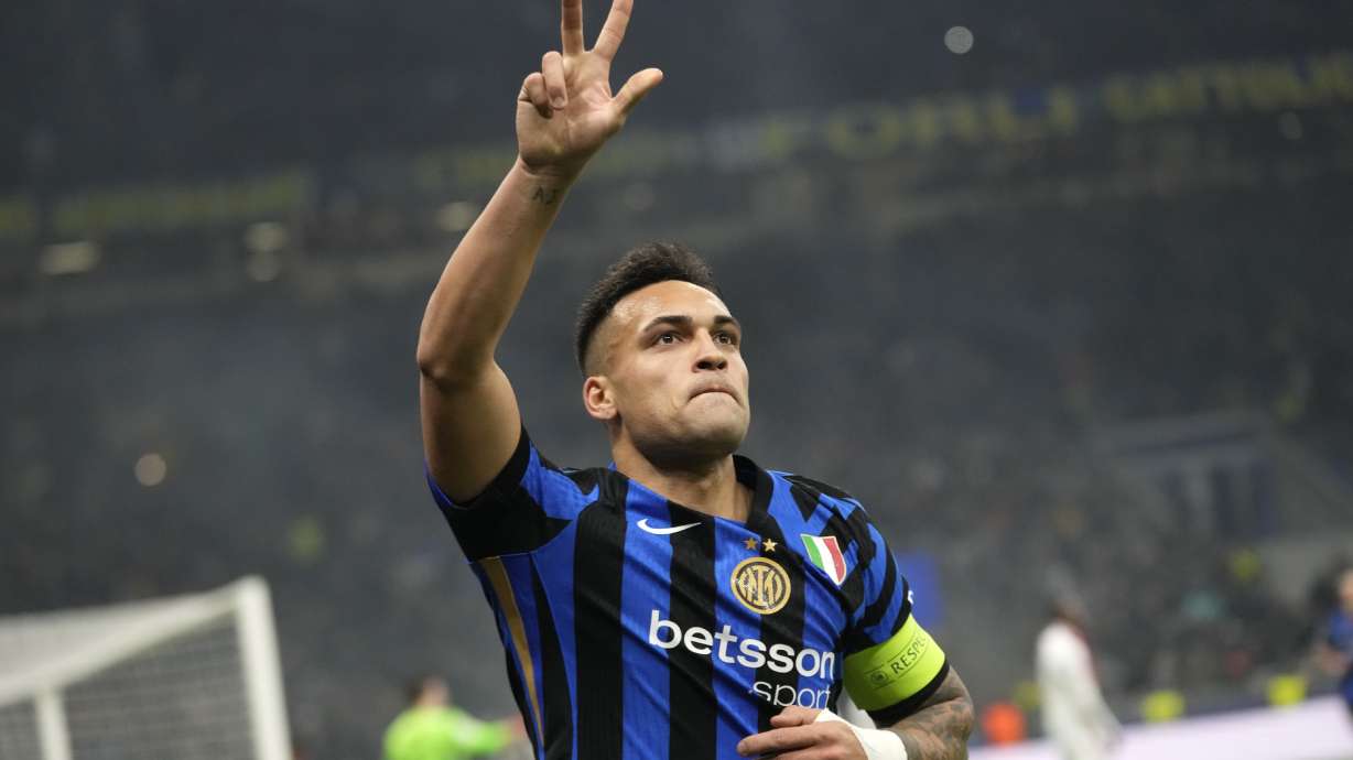 Inter Milan's Lautaro Martinez flashes up his three fingers as he's celebrates his third goal against Monaco during a Champions League opening phase soccer match between Inter Milan and Monaco, at the San Siro stadium in Milan, Italy, Wednesday, Jan. 29, 2025.