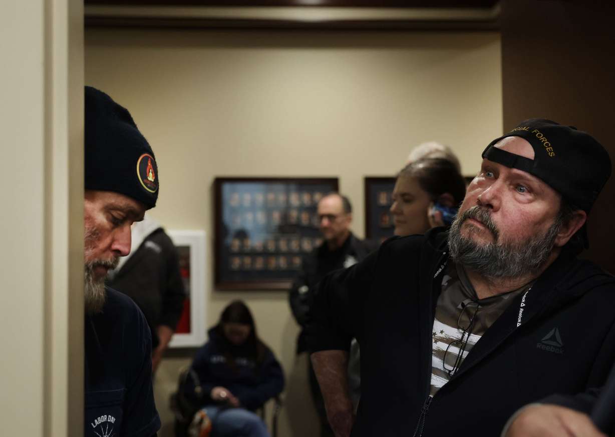 Labor union members, Steve Perry of IBEW 354, left, and Doug Underwood of ATU Local 382, listen from the hallway as HB267, a bill that would prohibit collective bargaining for public sector labor unions, is discussed during a Senate Revenue and Taxation Committee meeting at the Capitol in Salt Lake City on Wednesday.