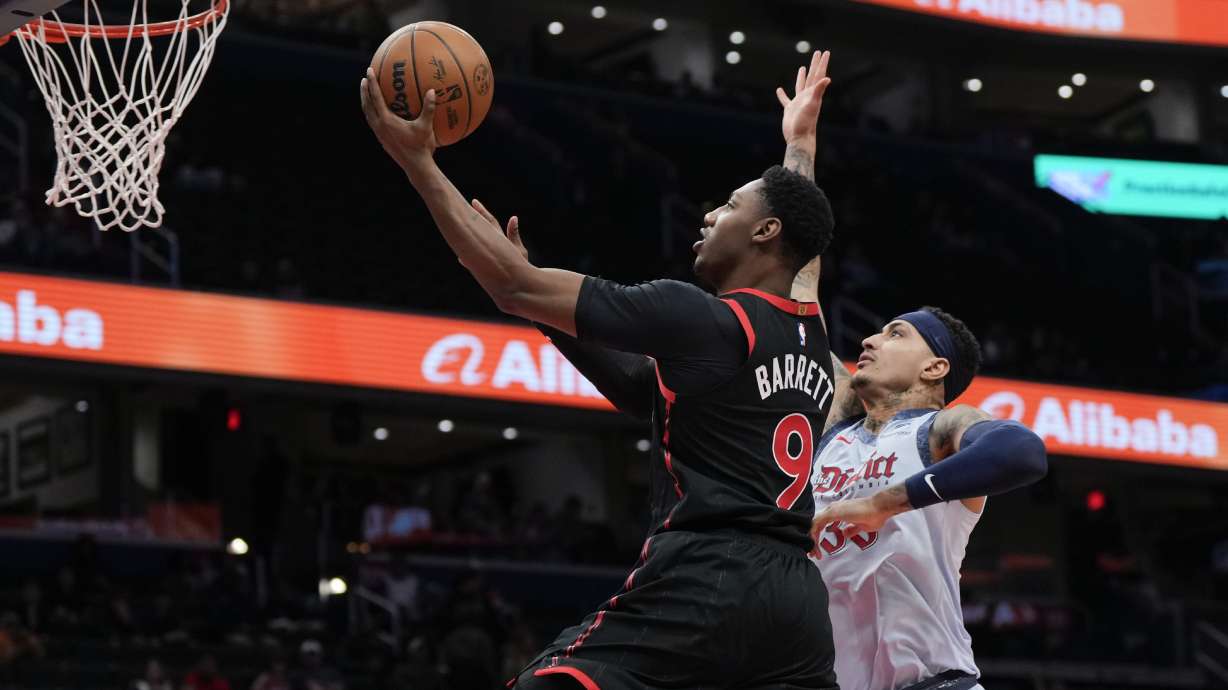 Toronto Raptors guard RJ Barrett (9) goes up for a shot against Washington Wizards forward Kyle Kuzma (33) during the first half of an NBA basketball game Wednesday, Jan. 29, 2025, in Washington.