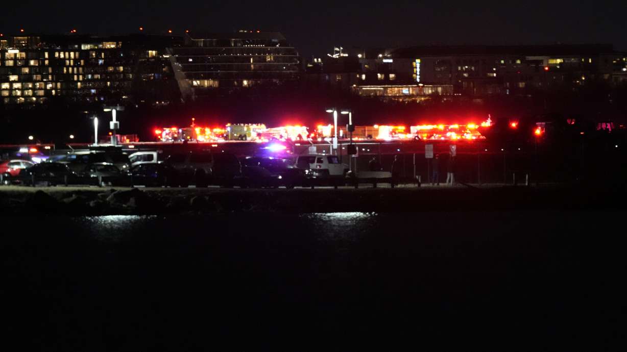 A view of emergency response looking from Arlington, Va., south of Ronald Reagan Washington National Airport, across the Potomac River toward the District of Columbia, Wednesday.
