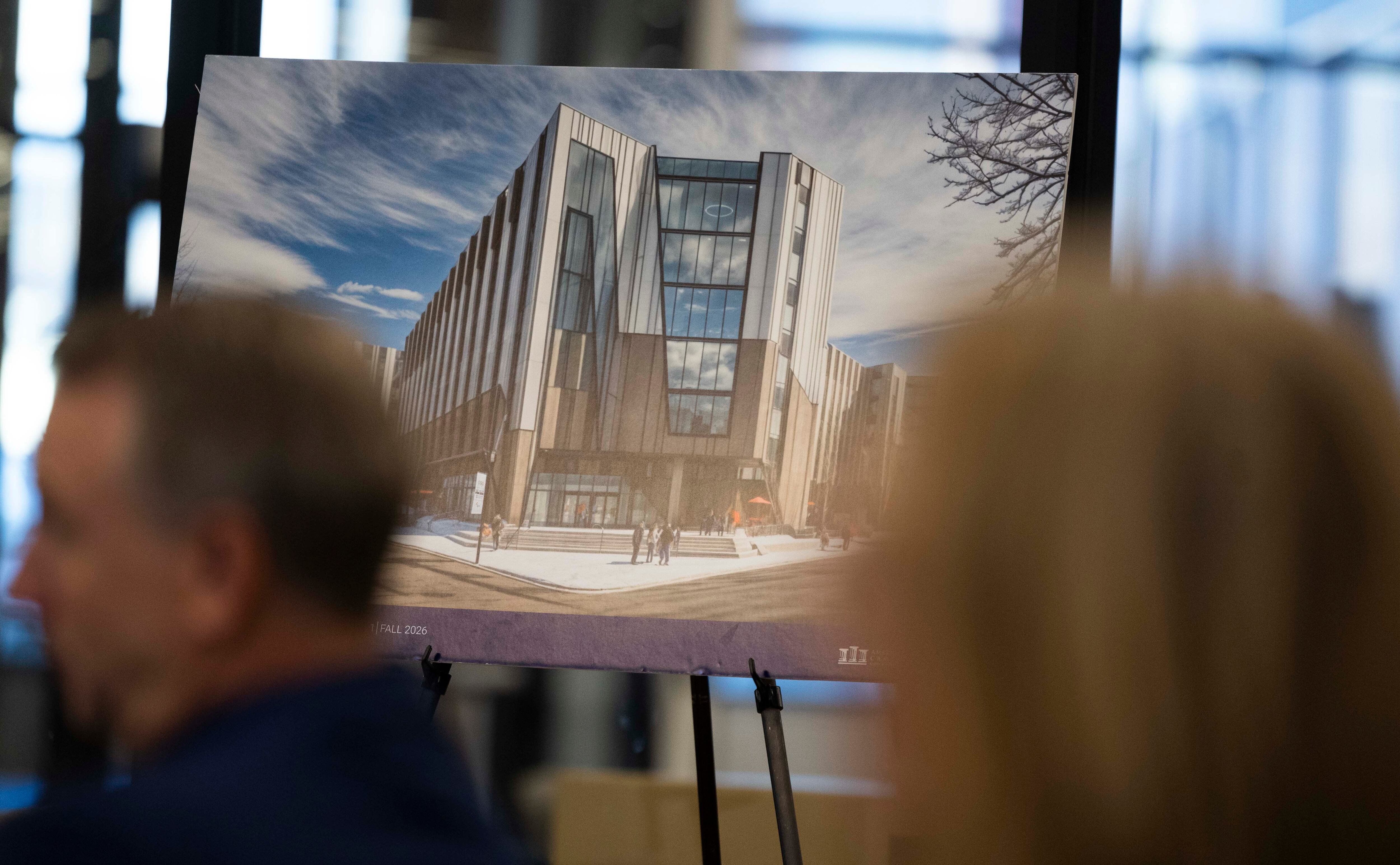 An artistic rendering of the planned dorms is displayed during a press conference and groundbreaking for a $155 million, 1,400-bed University of Utah student housing development, at Kahlert Village on the campus of the University of Utah in Salt Lake City on Wednesday.