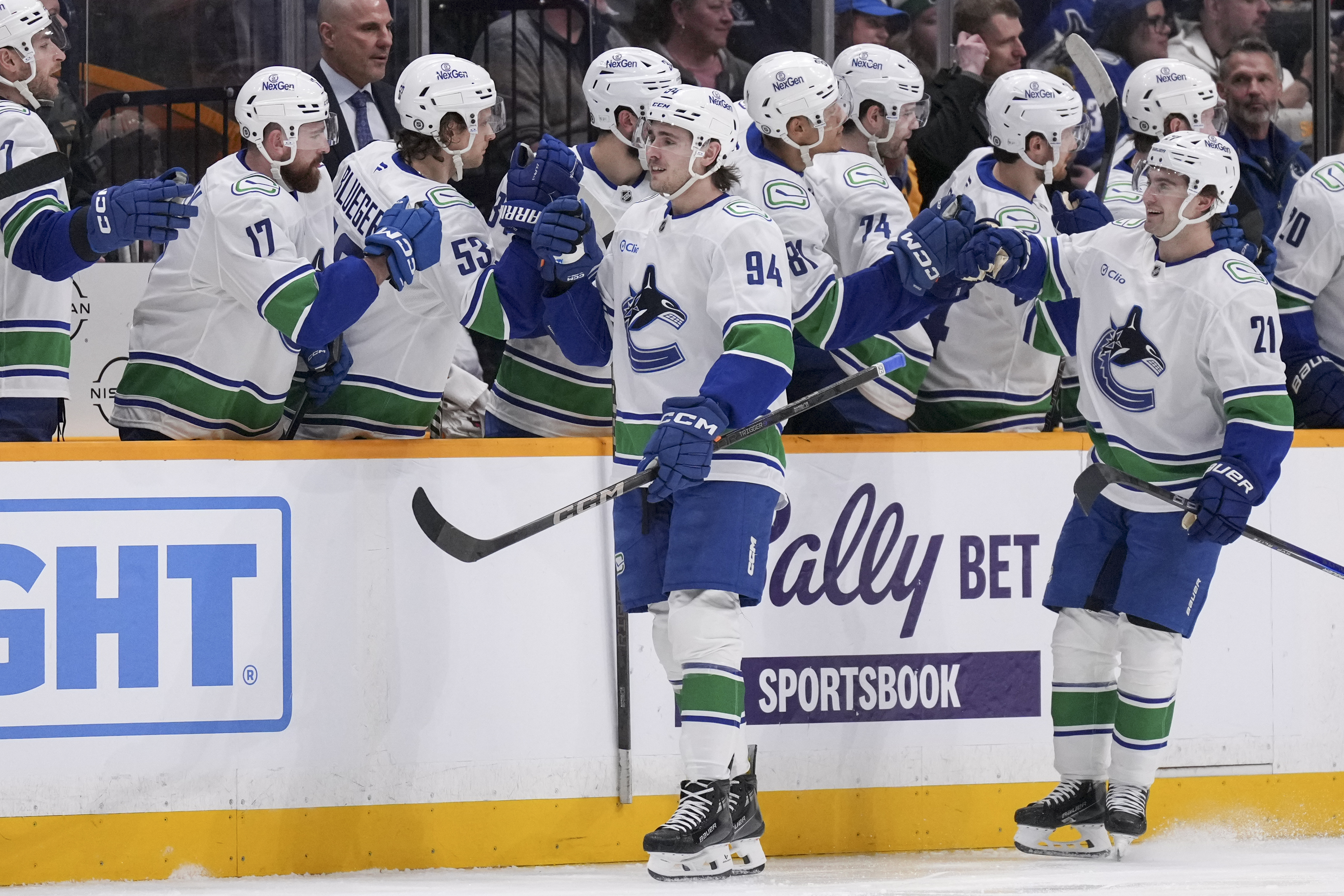 Vancouver Canucks center Linus Karlsson (94) celebrates his goal with teammates during the second period of an NHL hockey game against the Nashville Predators, Wednesday, Jan. 29, 2025, in Nashville, Tenn.