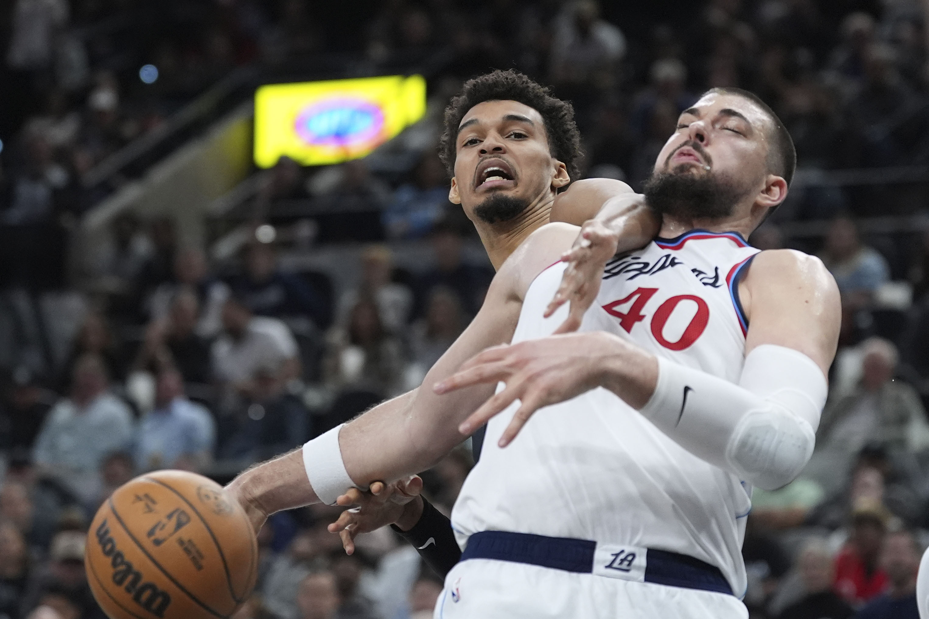 San Antonio Spurs center Victor Wembanyama, left, and LA Clippers center Ivica Zubac compete for a rebound during the first half of an NBA basketball game in San Antonio, Wednesday, Jan. 29, 2025. 