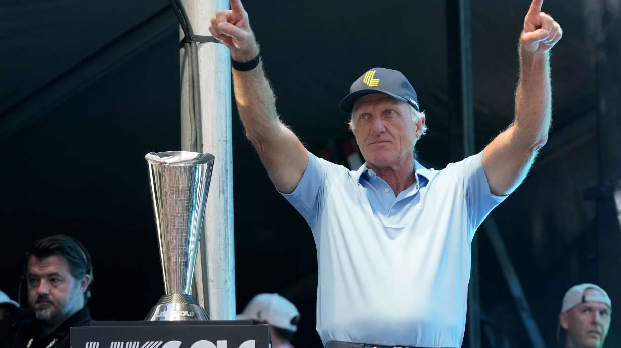 FILE - LIV Golf CEO Greg Norman waves to the crowd during an award presentation at the LIV Golf Team Championship at the Trump National Doral golf club, Oct. 22, 2023, in Doral, Fla.
