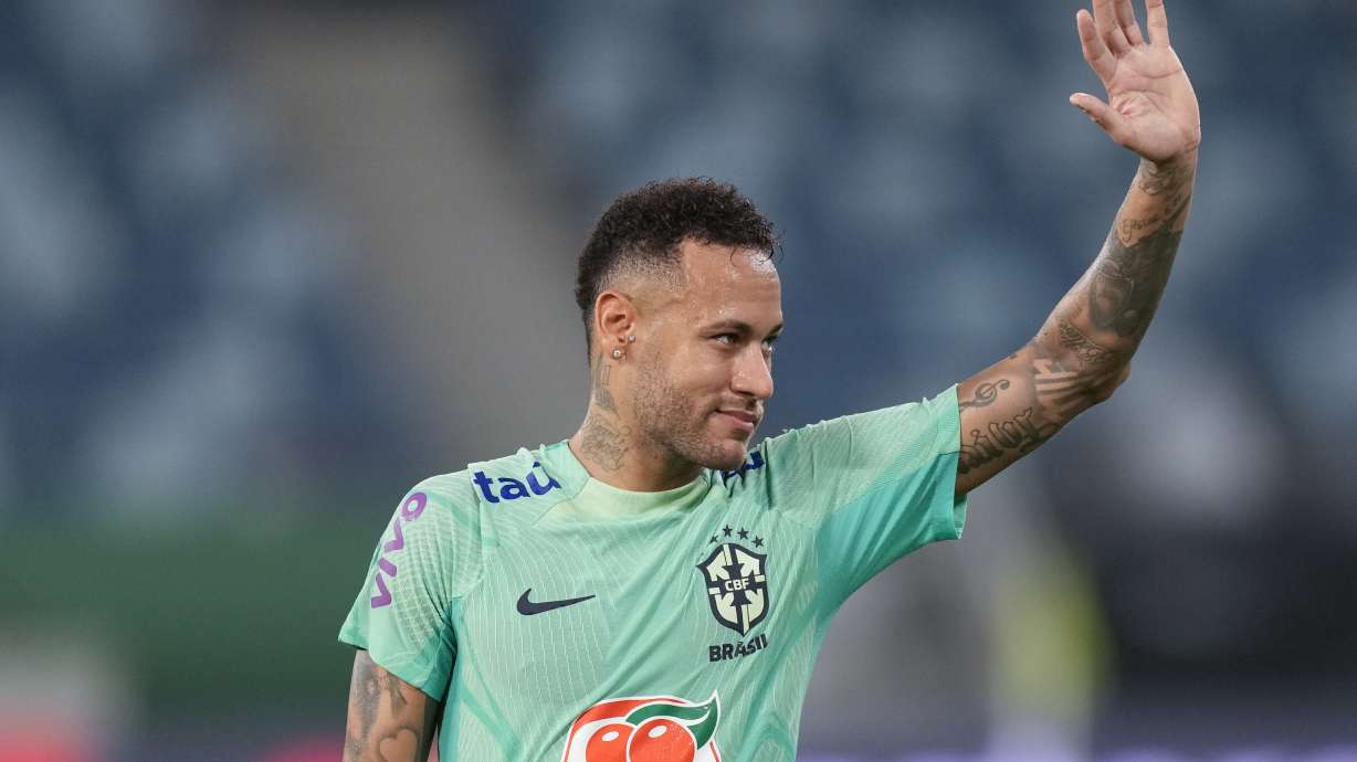 FILE - Brazil's Neymar waves to fans during a training session in Cuiaba, Brazil, Tuesday, Oct. 10, 2023.